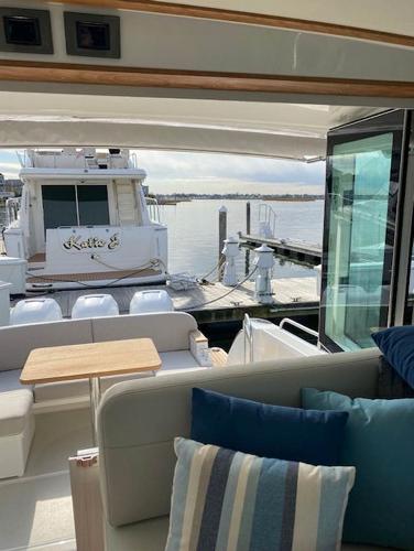 Back Cove 39O 2025 model yacht interior with dock view.