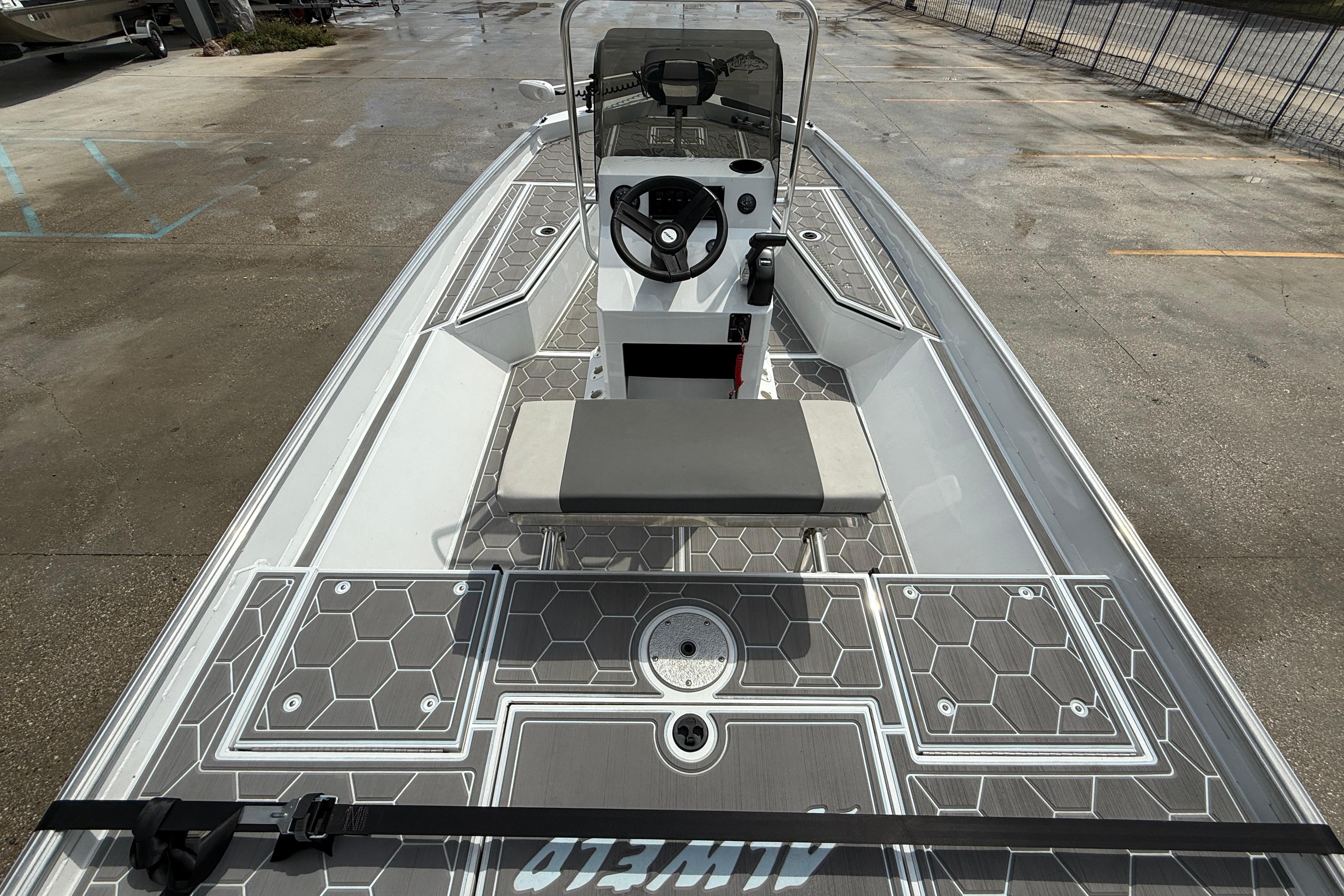 2024 Alweld 2070cc boat with modern console and hexagonal deck pattern.