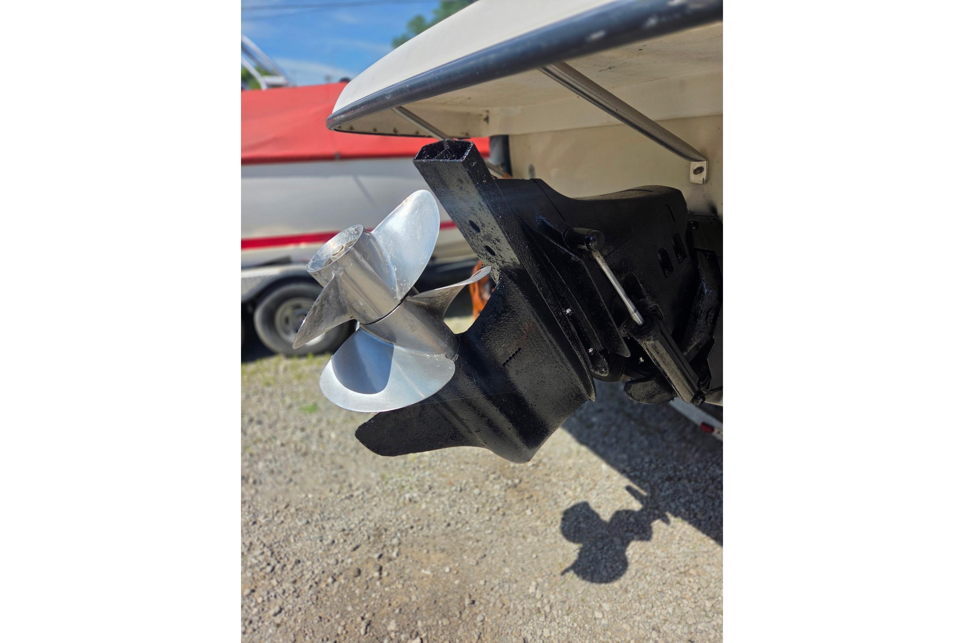 Close-up of a 2001 Crownline 242 CR boat propeller and outdrive.