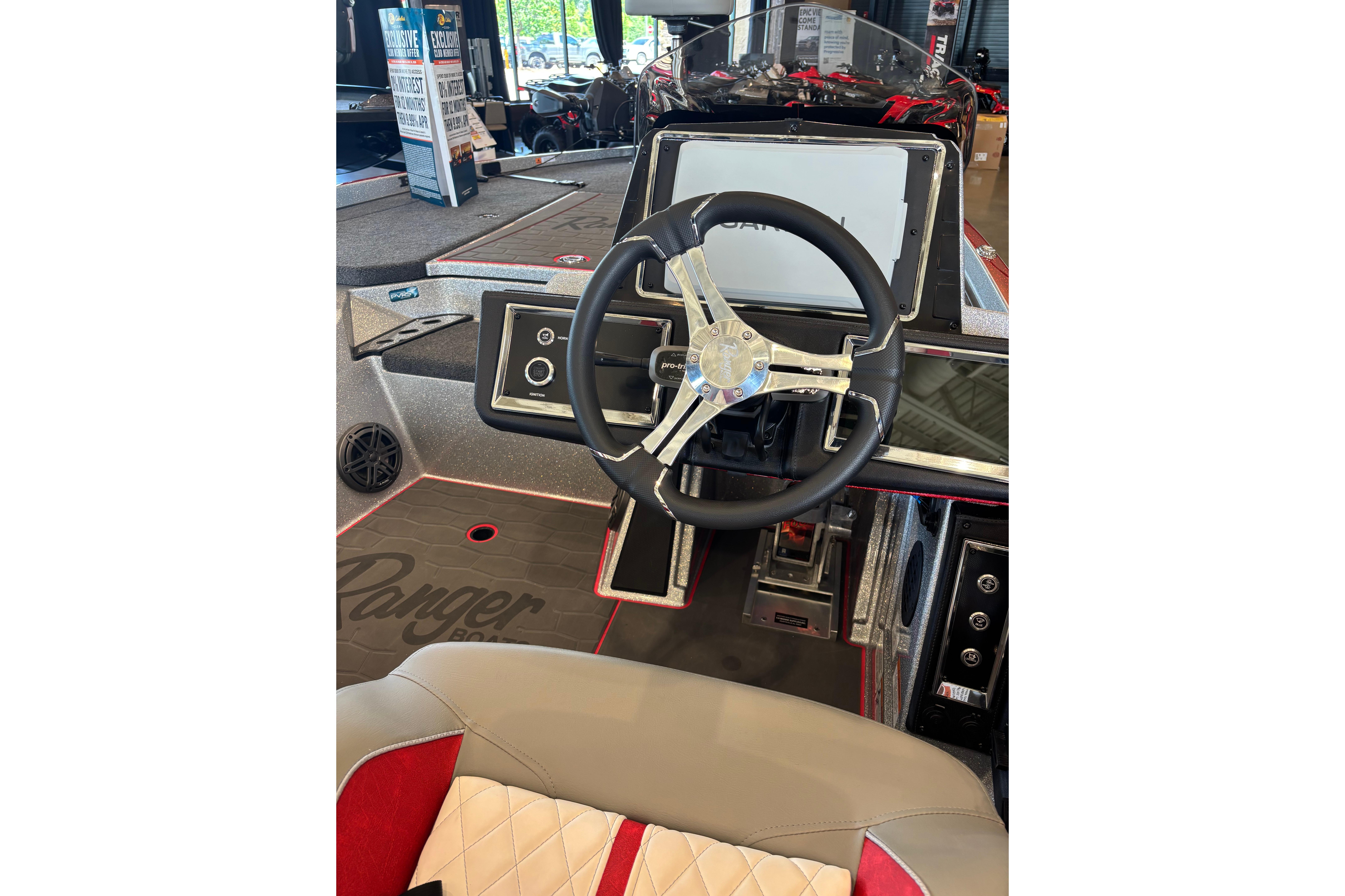 2026 Ranger Z520R Cup-Equipped boat interior with steering wheel and dashboard.
