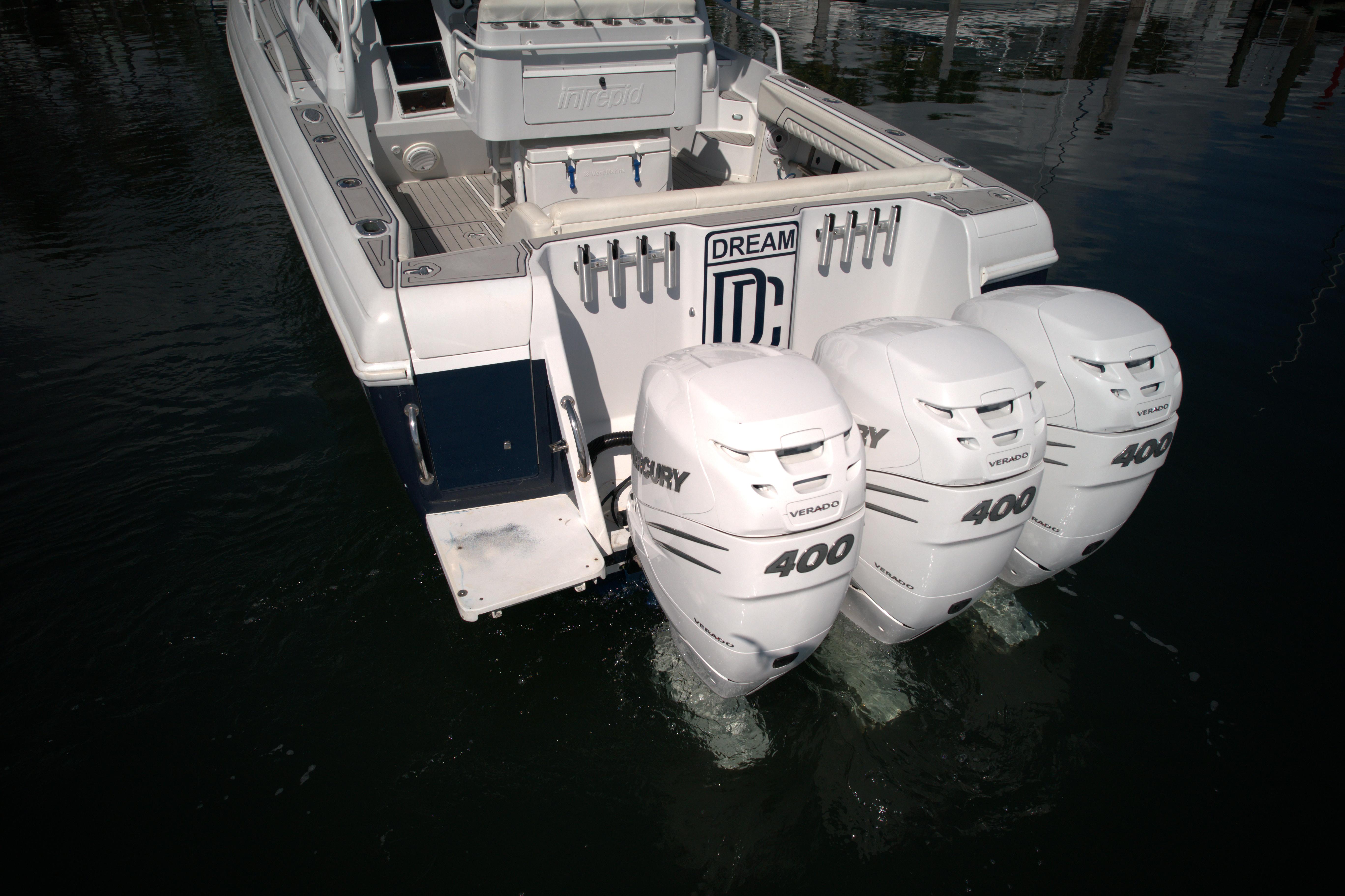 2002 Intrepid 377 Walkaround Cuddy with triple Mercury 400 outboard engines.