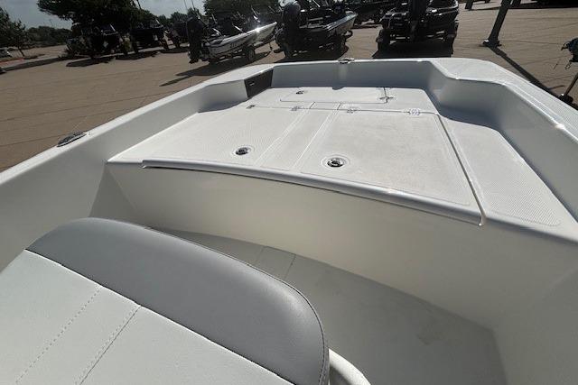 2026 Mako Pro Skiff 15 CC boat interior with seating and storage compartments.