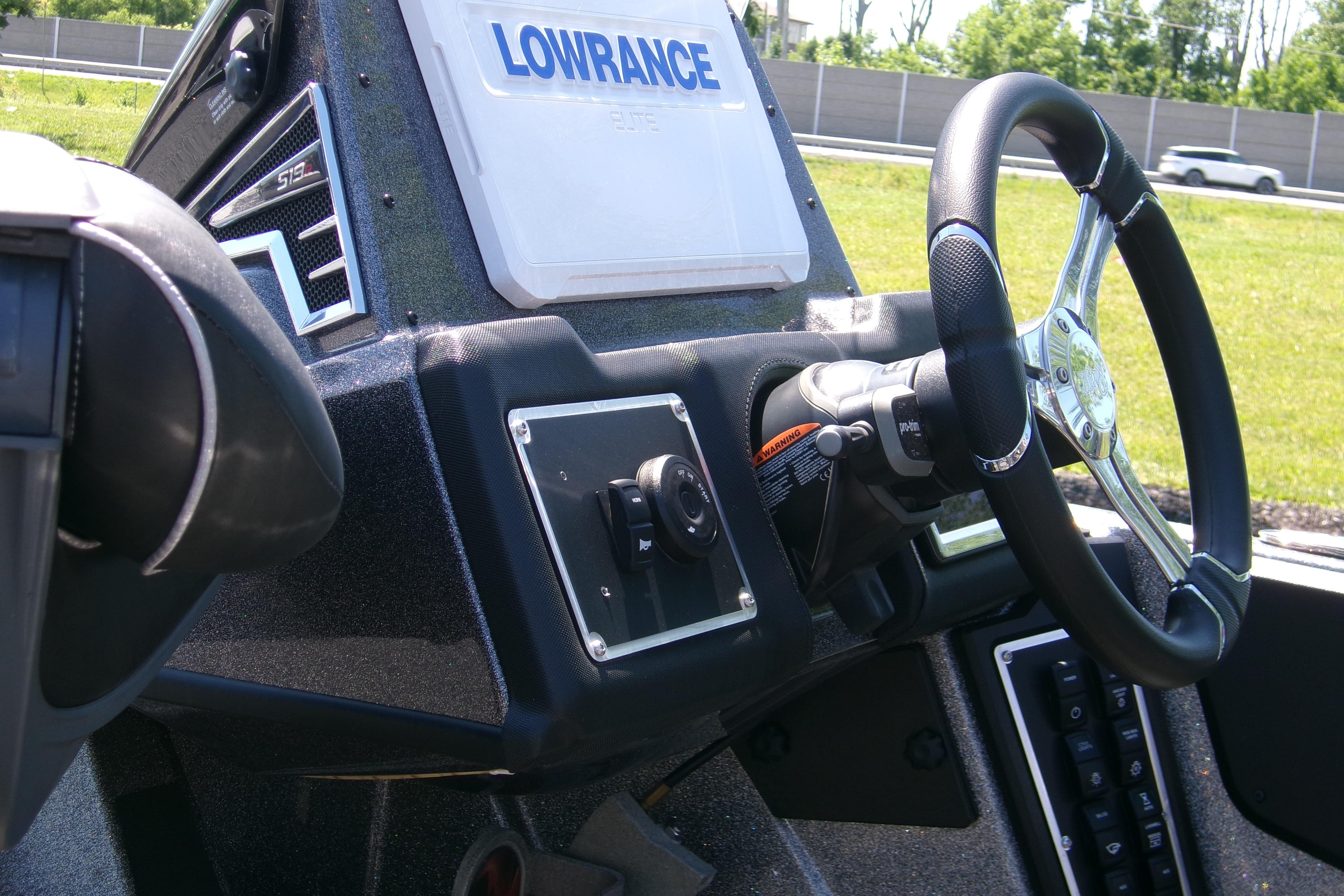2025 Ranger Z519R Cup-Equipped boat dashboard with Lowrance electronics and steering wheel.