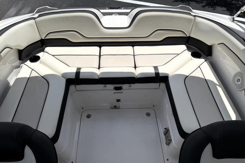 2017 Yamaha Boats SX210 interior seating area with white and black upholstery.