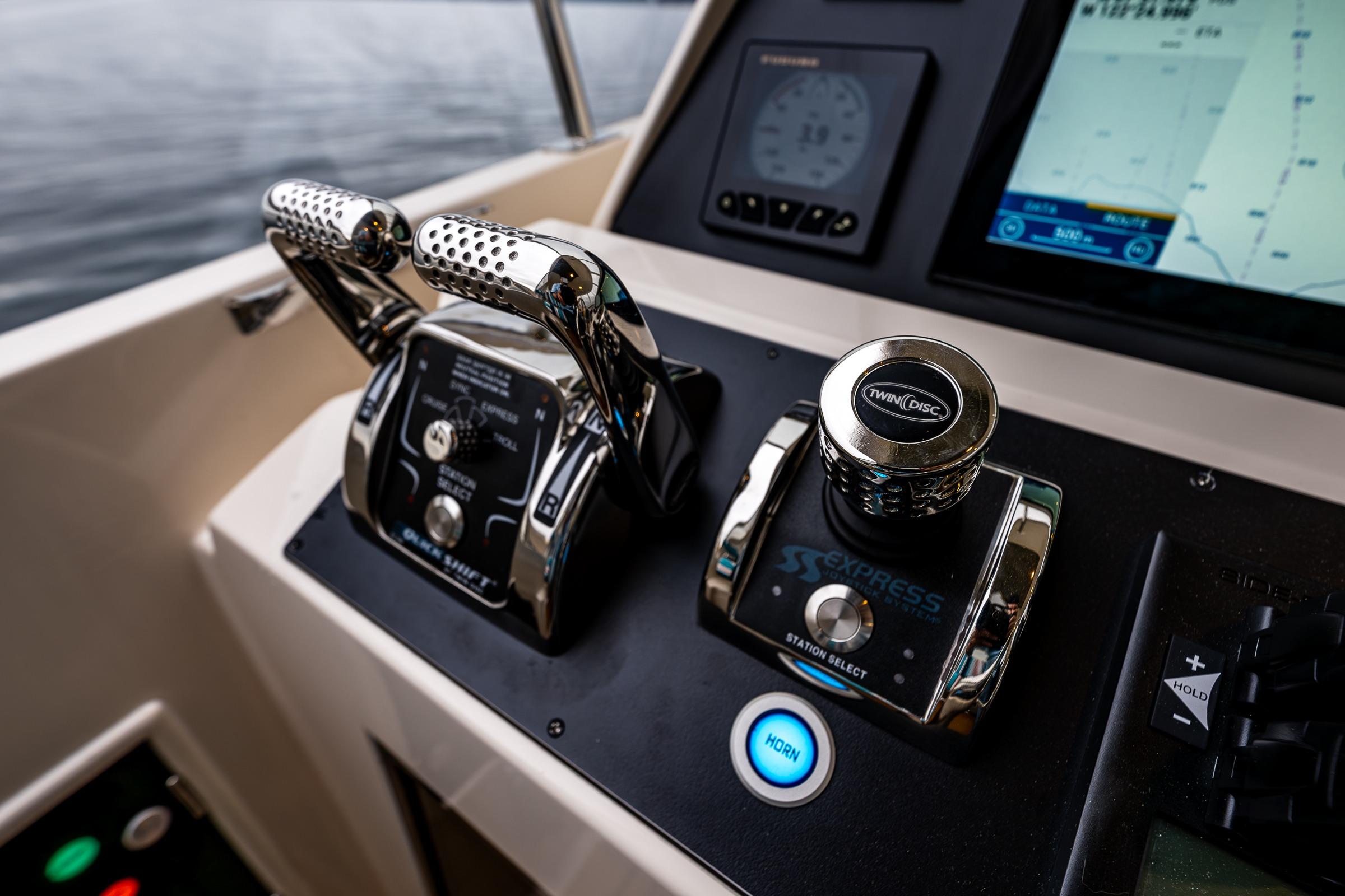 Control panel of a 2026 Fleming 55 Pilothouse yacht with advanced navigation systems.