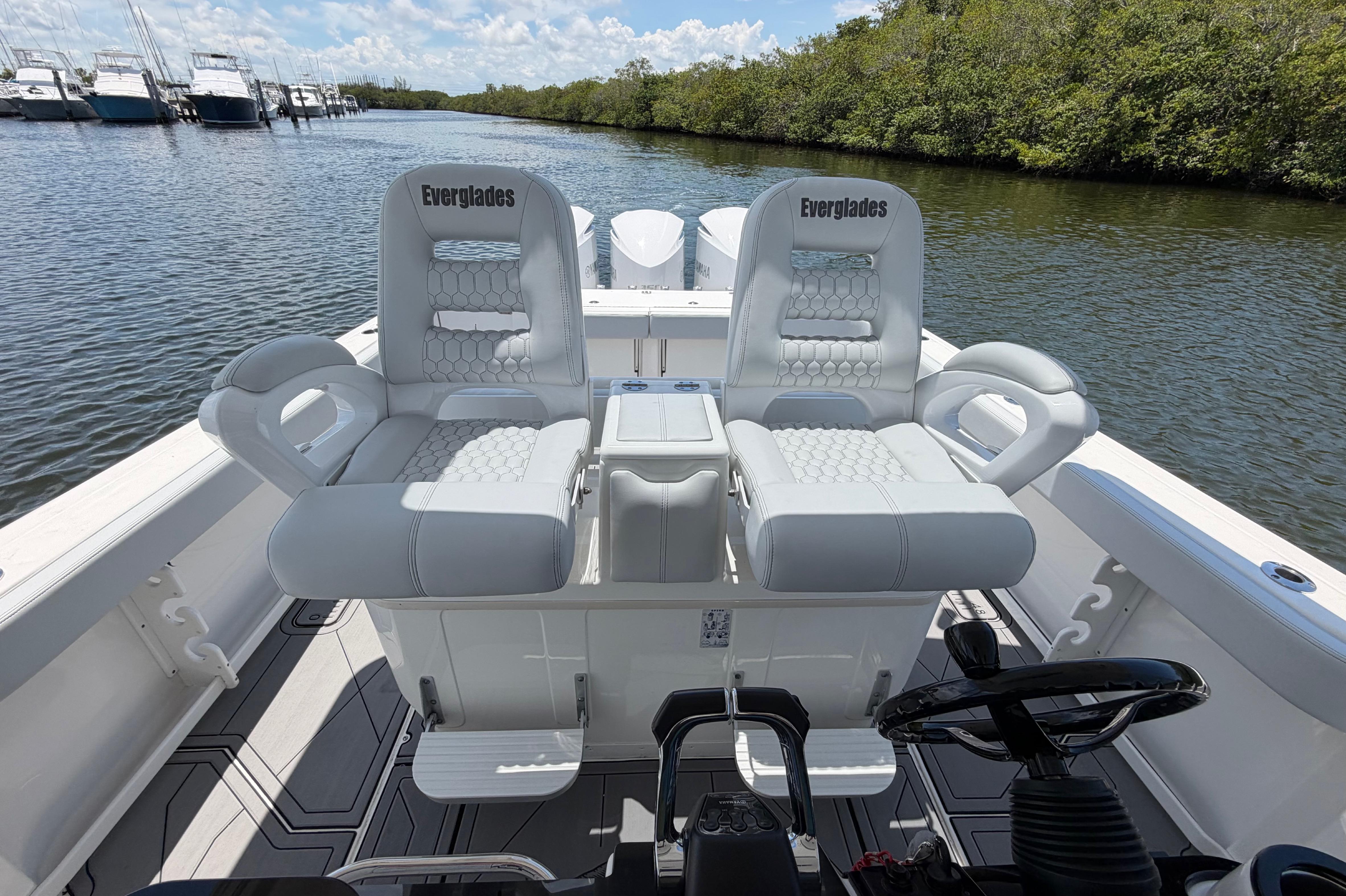 2009 Everglades 350LX boat interior with luxurious seating on a calm waterway.