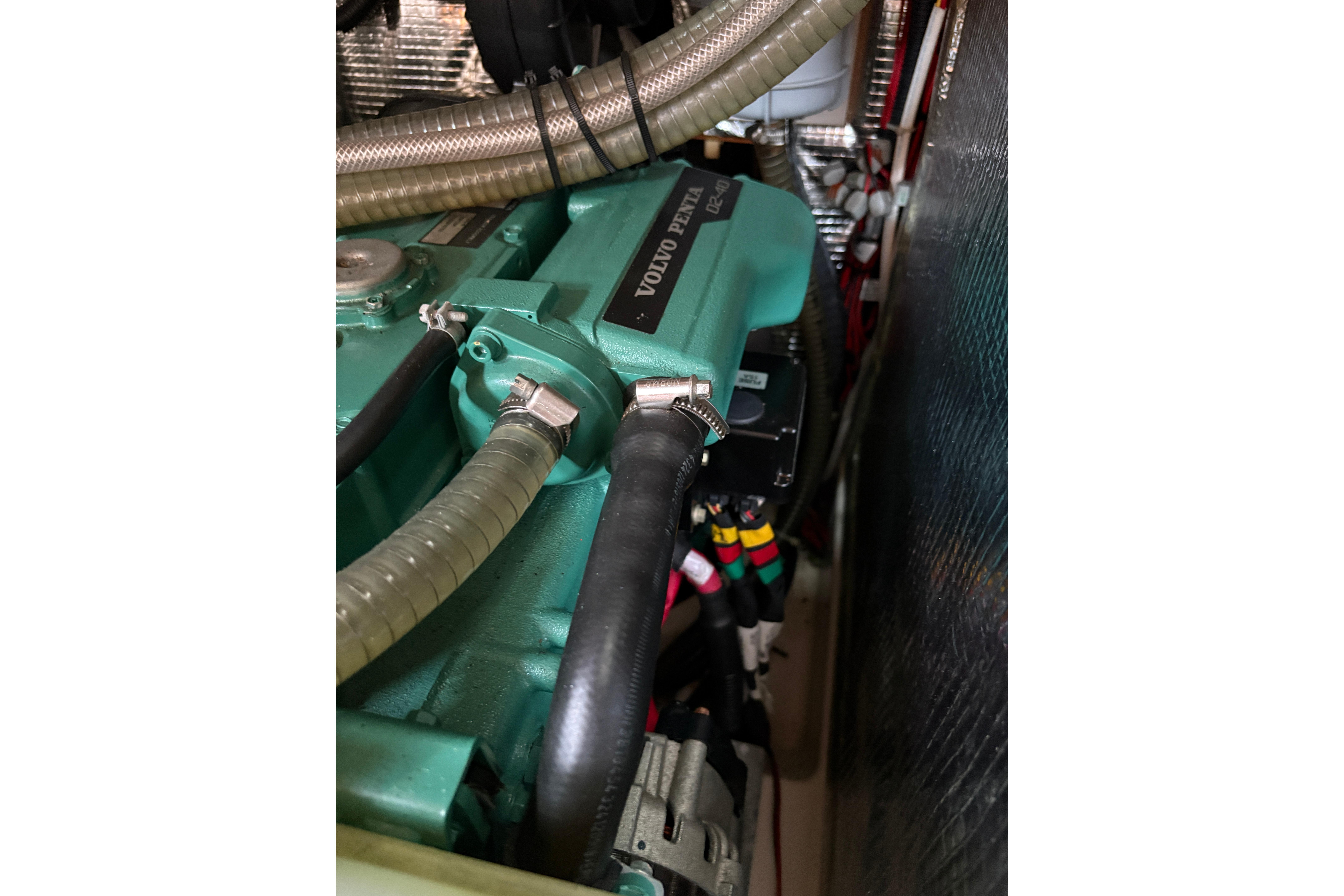 Engine compartment of a 2014 Hanse 415 sailboat with visible Volvo Penta components.