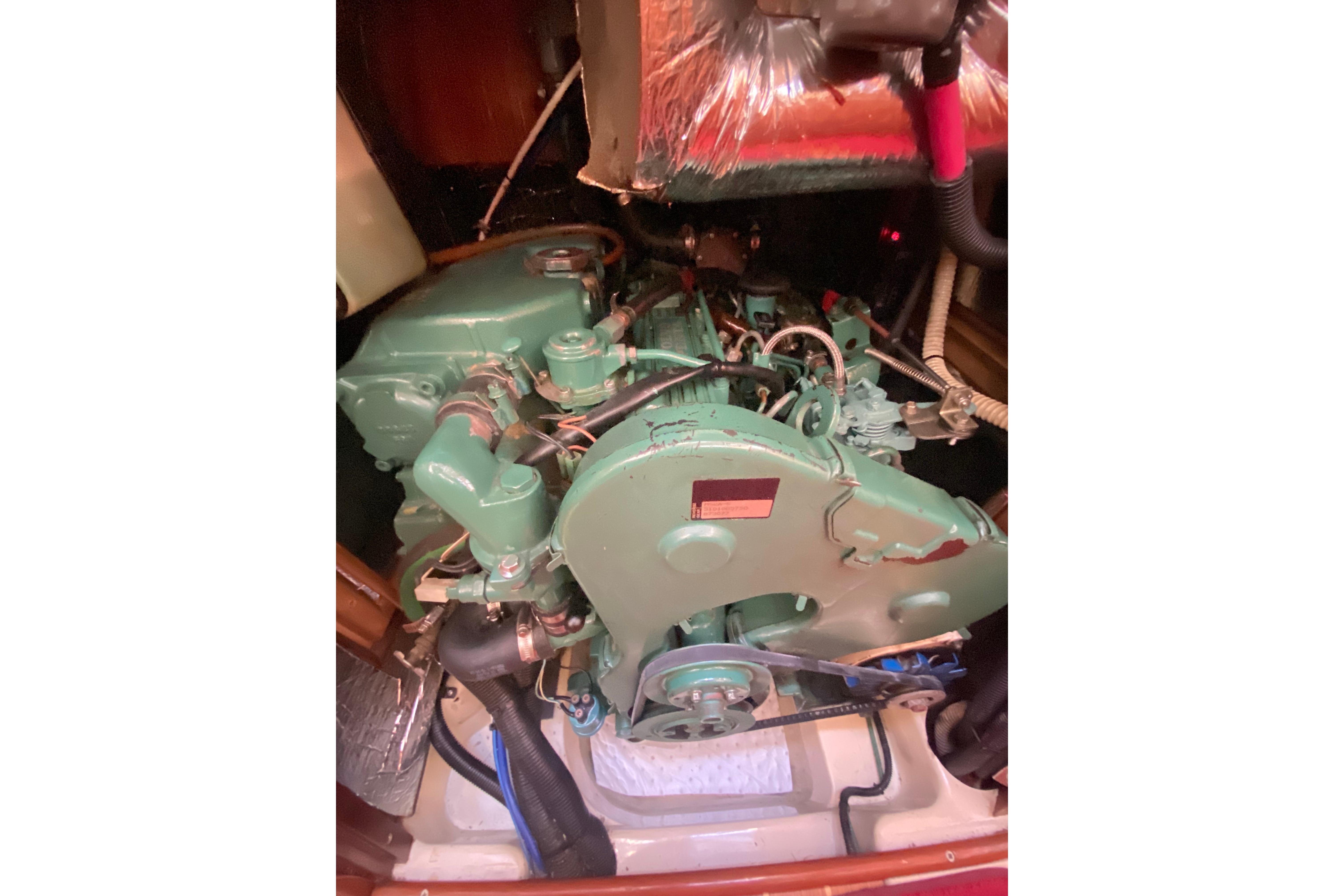 Engine compartment of a 1997 Hunter Legend 40.5 sailboat, showcasing mechanical components.
