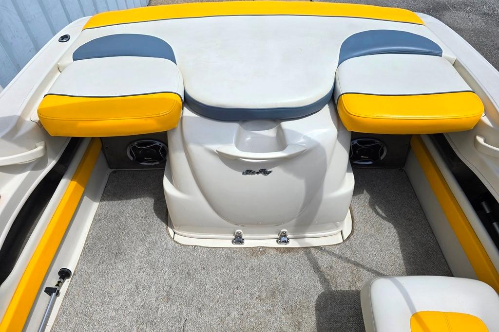 2007 Sea Ray 205 Sport boat interior with yellow and gray seating.