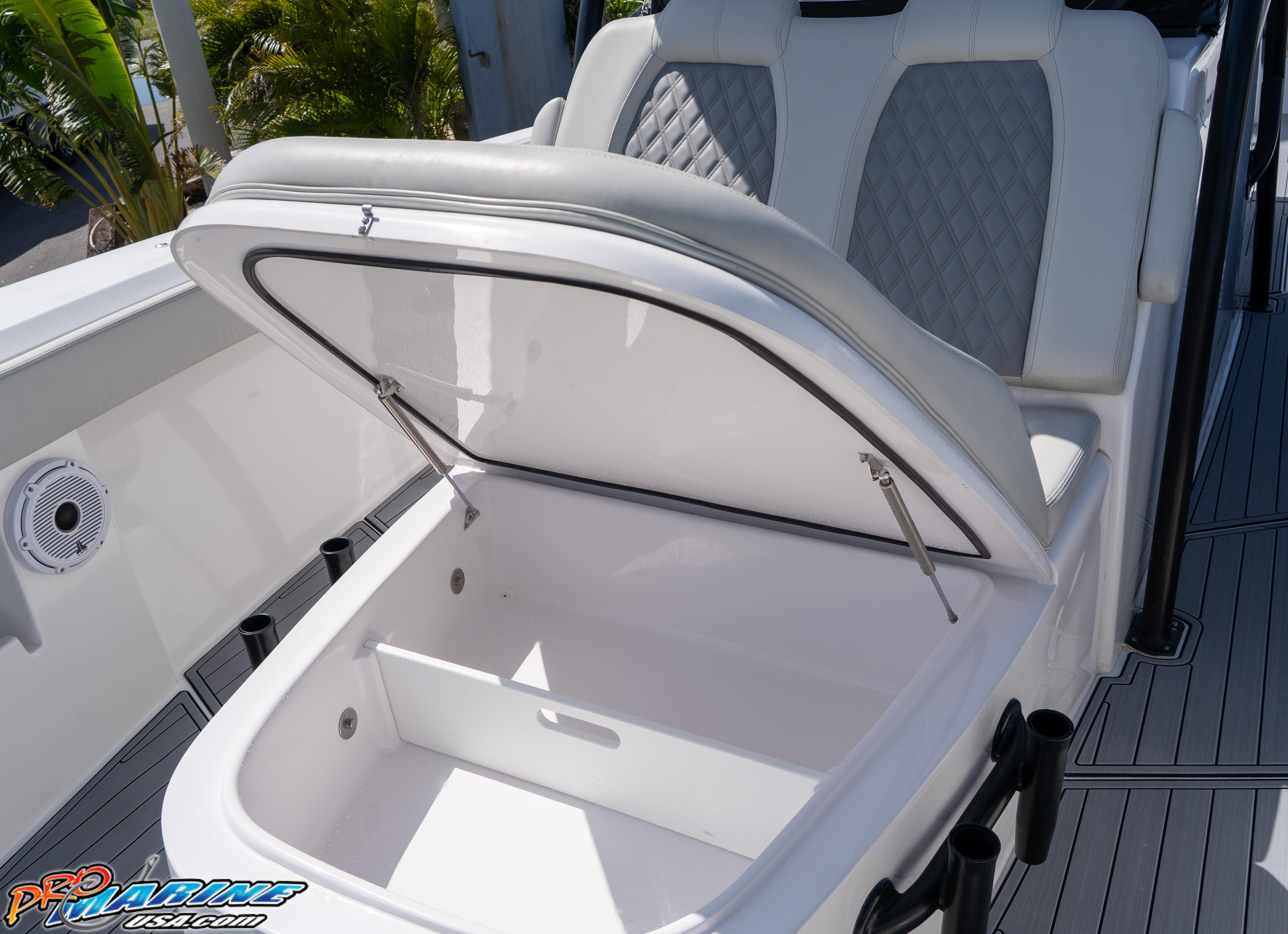 2023 Front Runner 39 Center Console boat with open storage compartment and cushioned seating.