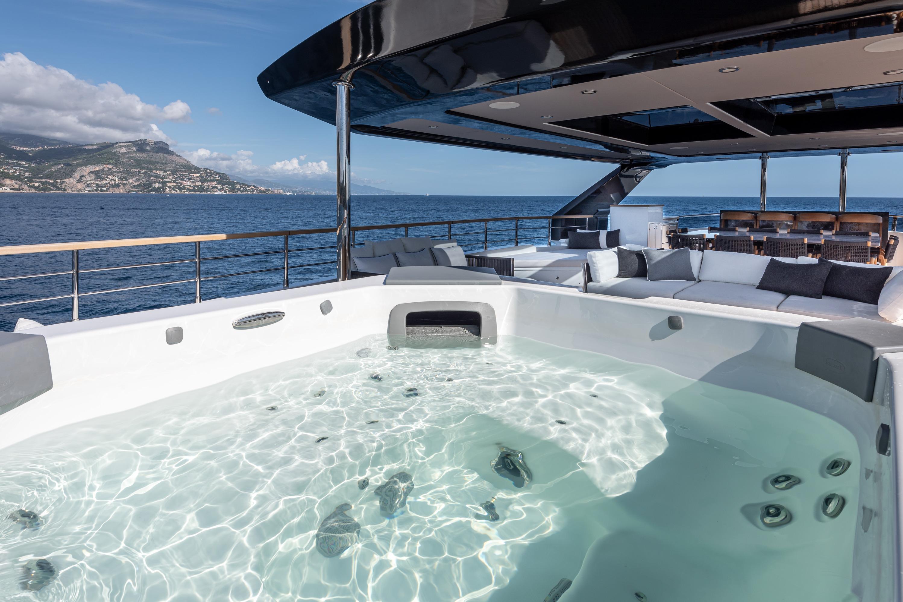Luxurious 2025 Numarine 37XP yacht with jacuzzi and ocean view.