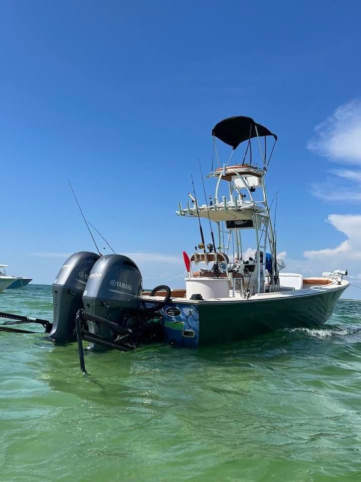 2007 Dorado 30 boat with Yamaha engines on the water.