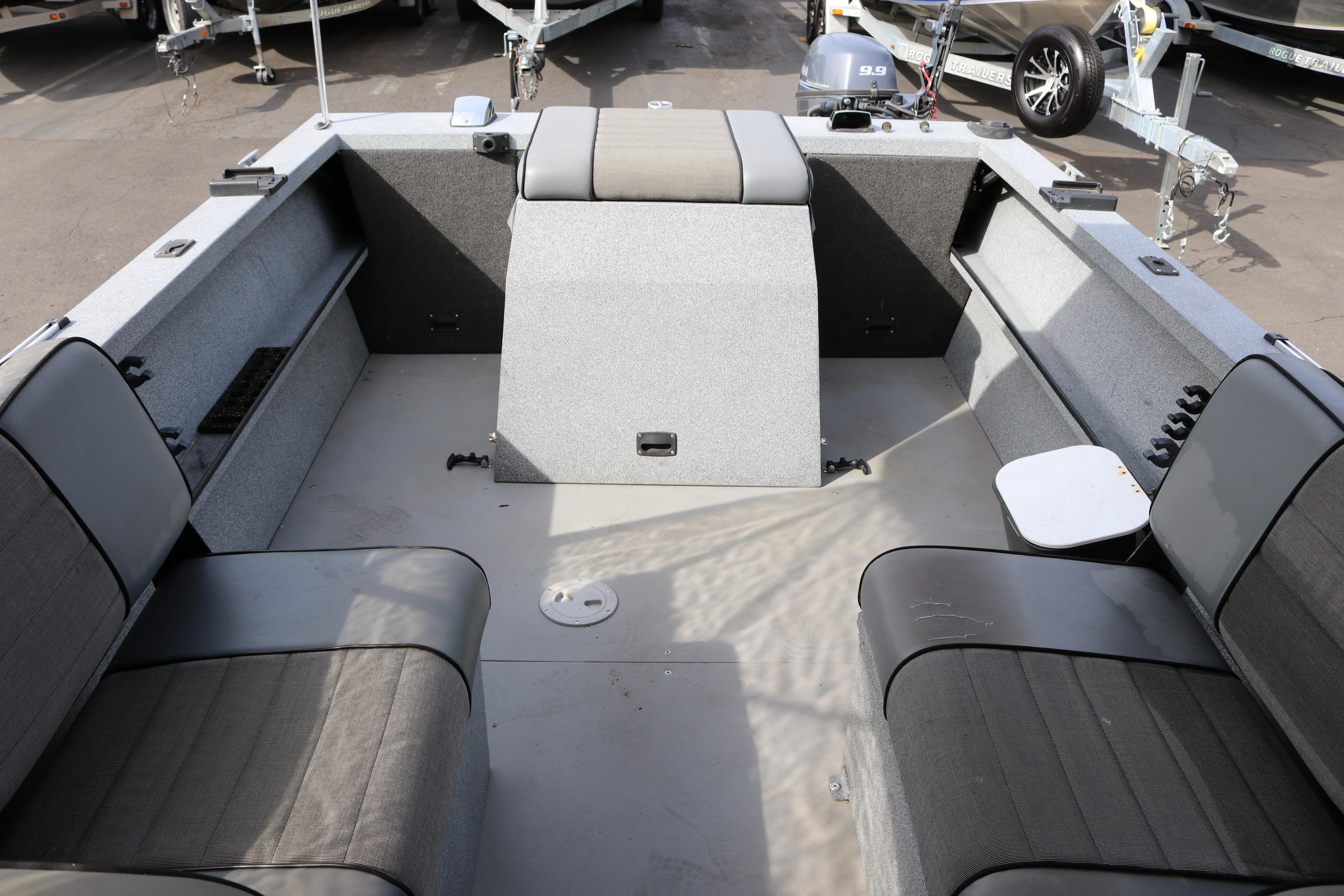 2004 Alumaweld STRYKER 19 boat interior with seating and storage compartments.