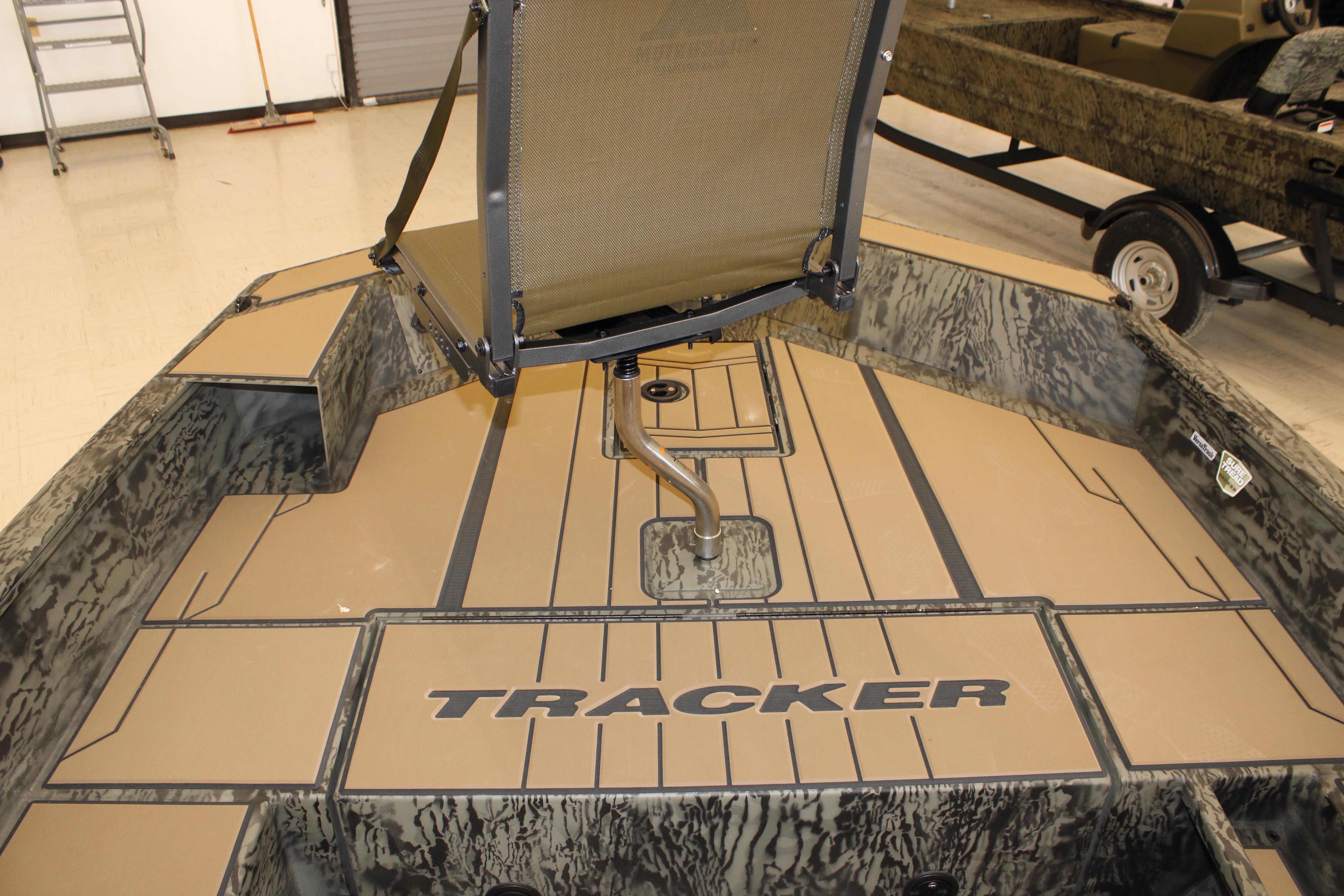 2026 Tracker Grizzly 1756 T Marsh boat interior with camo design and seating.