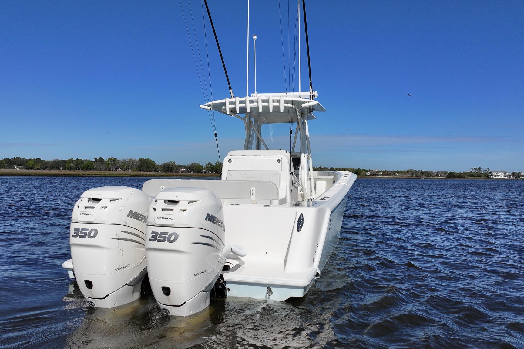 2022 SeaVee 322Z boat with twin Mercury 350 engines on a calm water body.