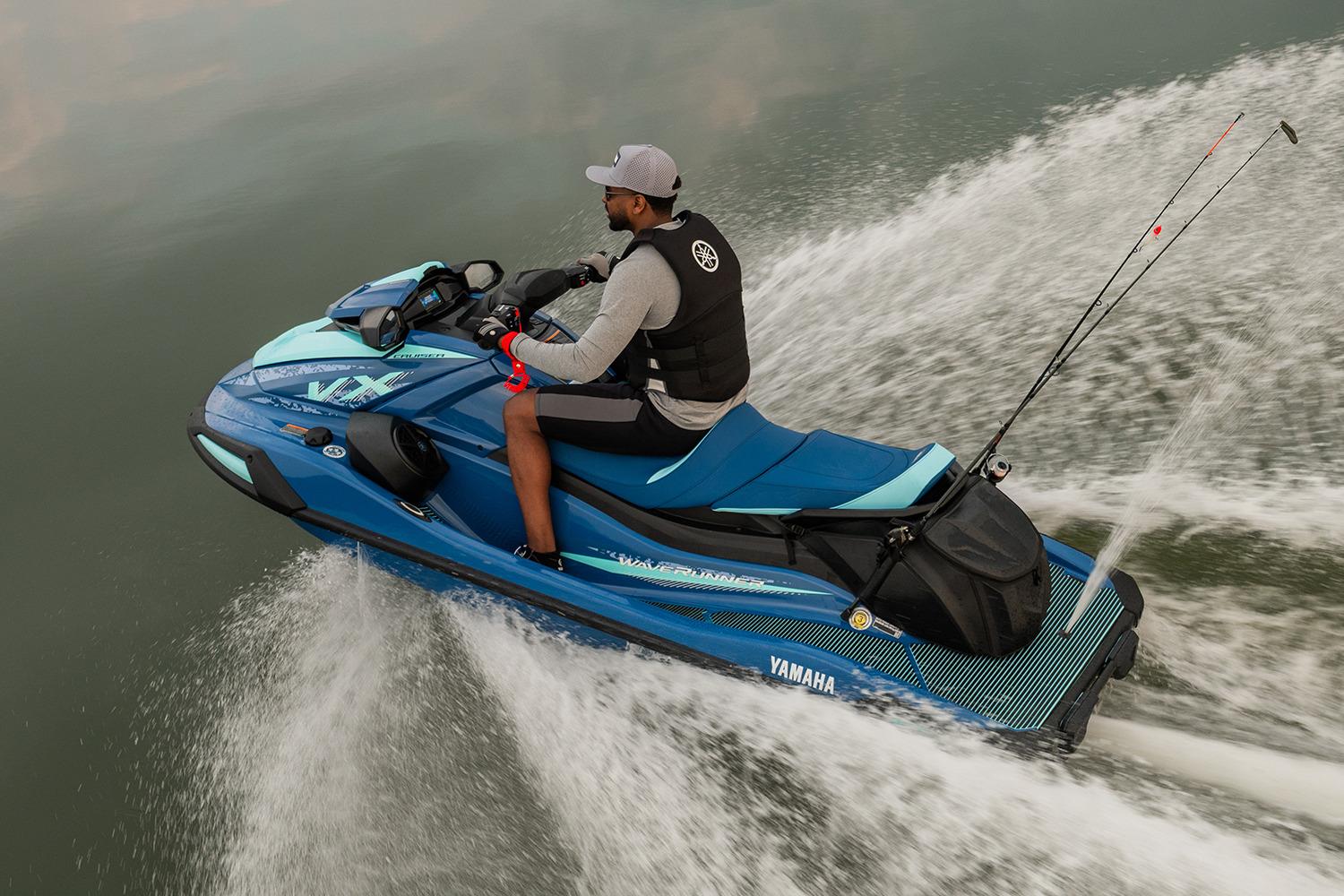 Manufacturer Provided Image: 2026 Yamaha WaveRunner VX Cruiser on water, rider in action, fishing rods attached.