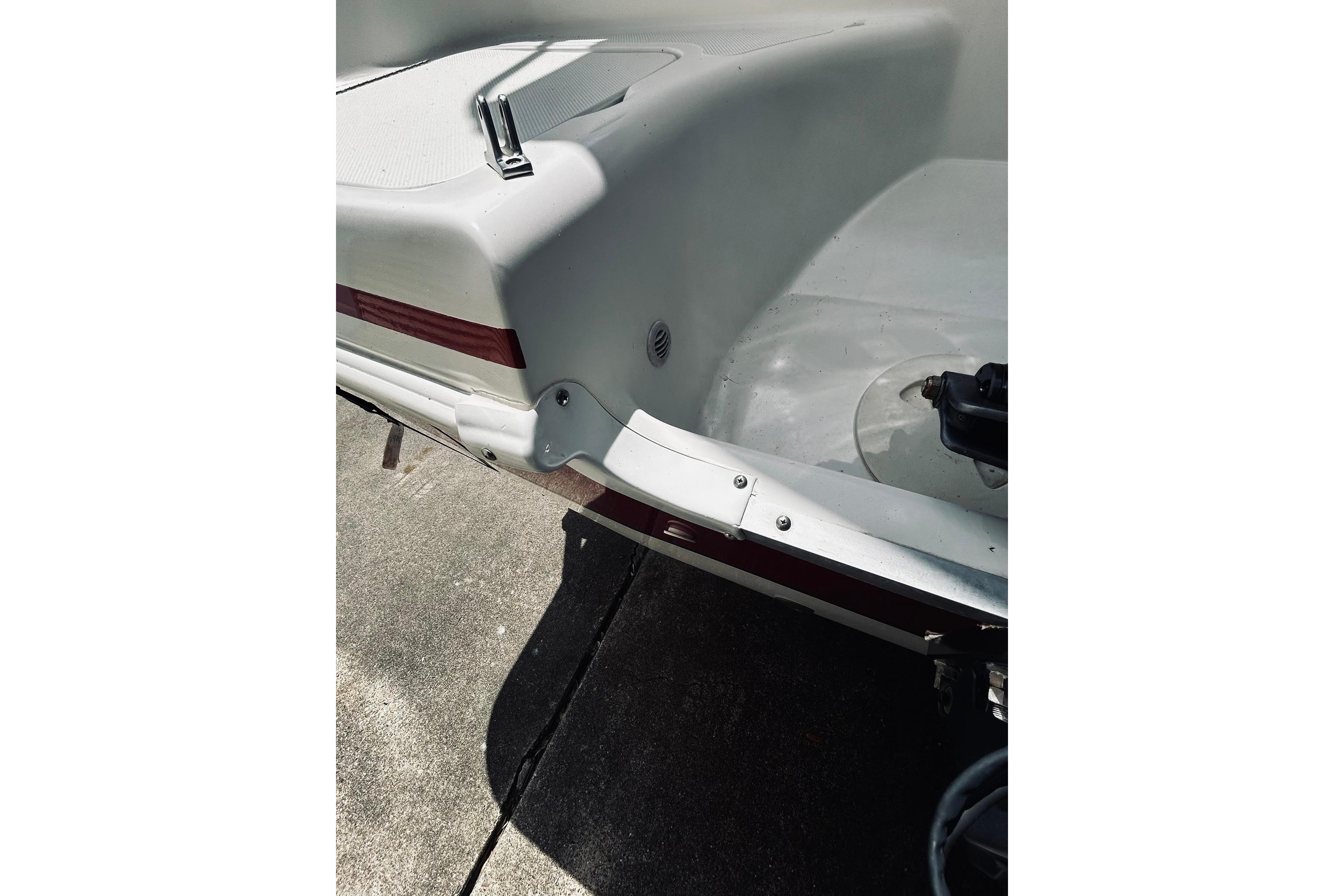 2013 Hurricane SunDeck Sport 201 OB boat rear view, showcasing sleek design and details.