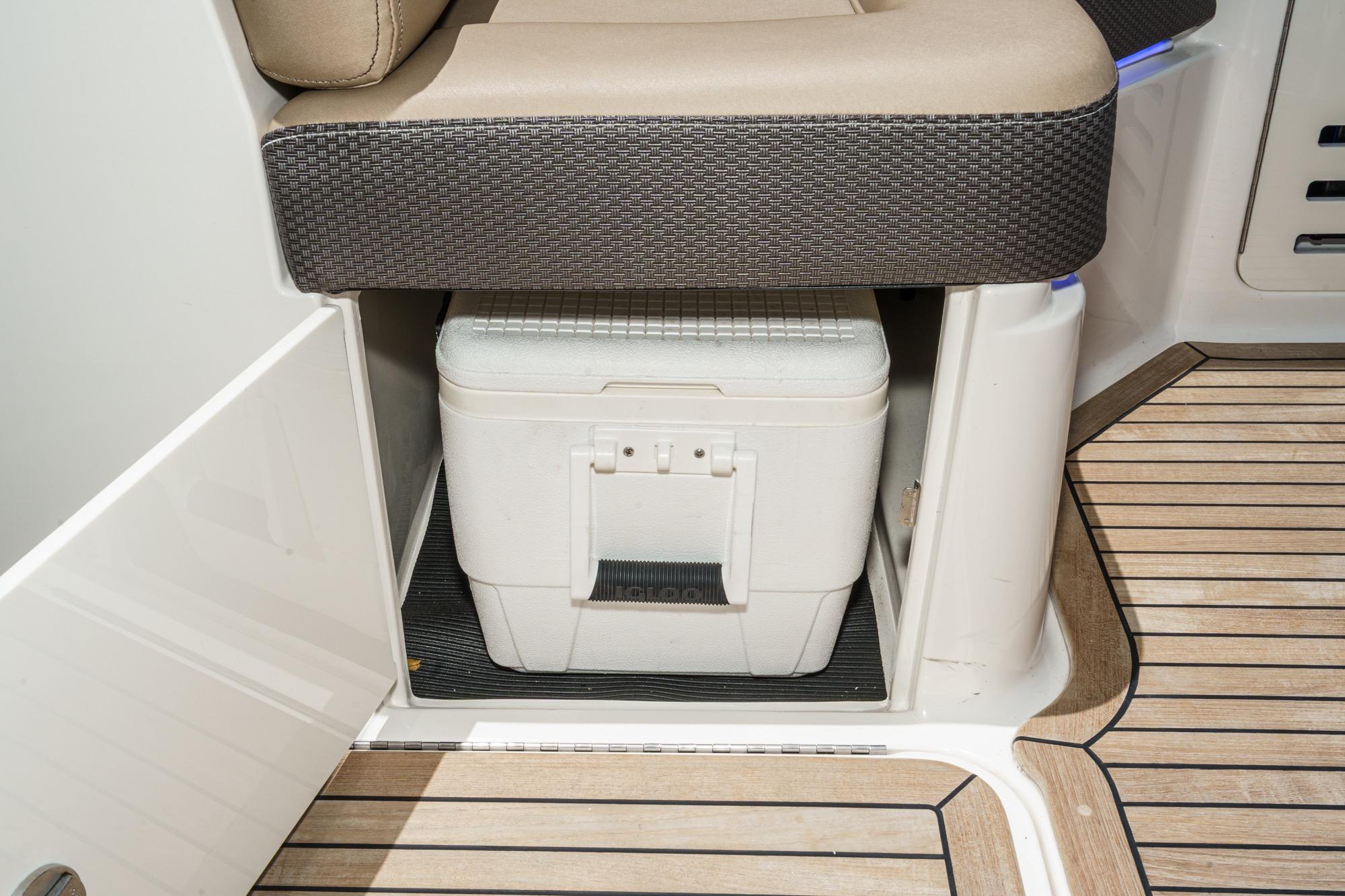 2018 Sea Ray SLX 310 boat interior with cooler storage under seat.