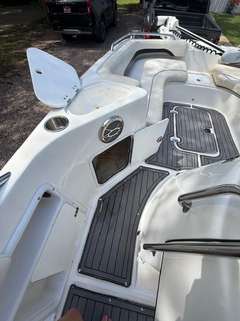 The image shows the deck of a 2016 Hurricane SunDeck Sport 231 OB boat.