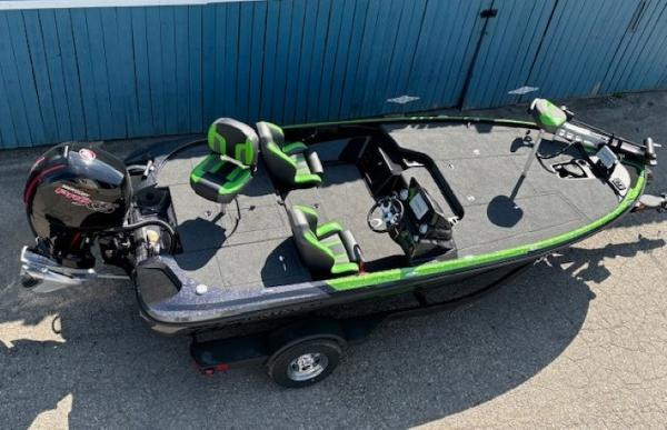 2025 Nitro Z18 Pro fishing boat with green accents, parked on a trailer.