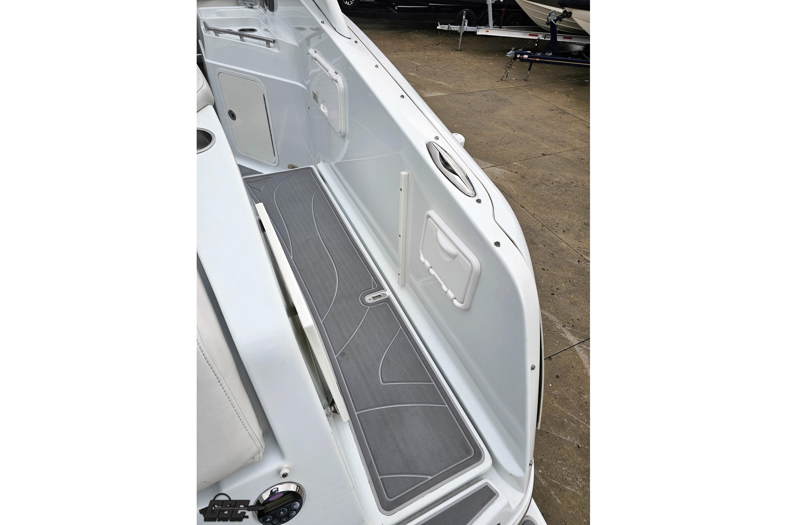 2008 Baja 335 Performance boat interior with sleek gray flooring and white paneling.