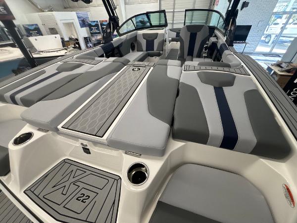 2025 MasterCraft XT22 boat interior with sleek gray and blue seating design.