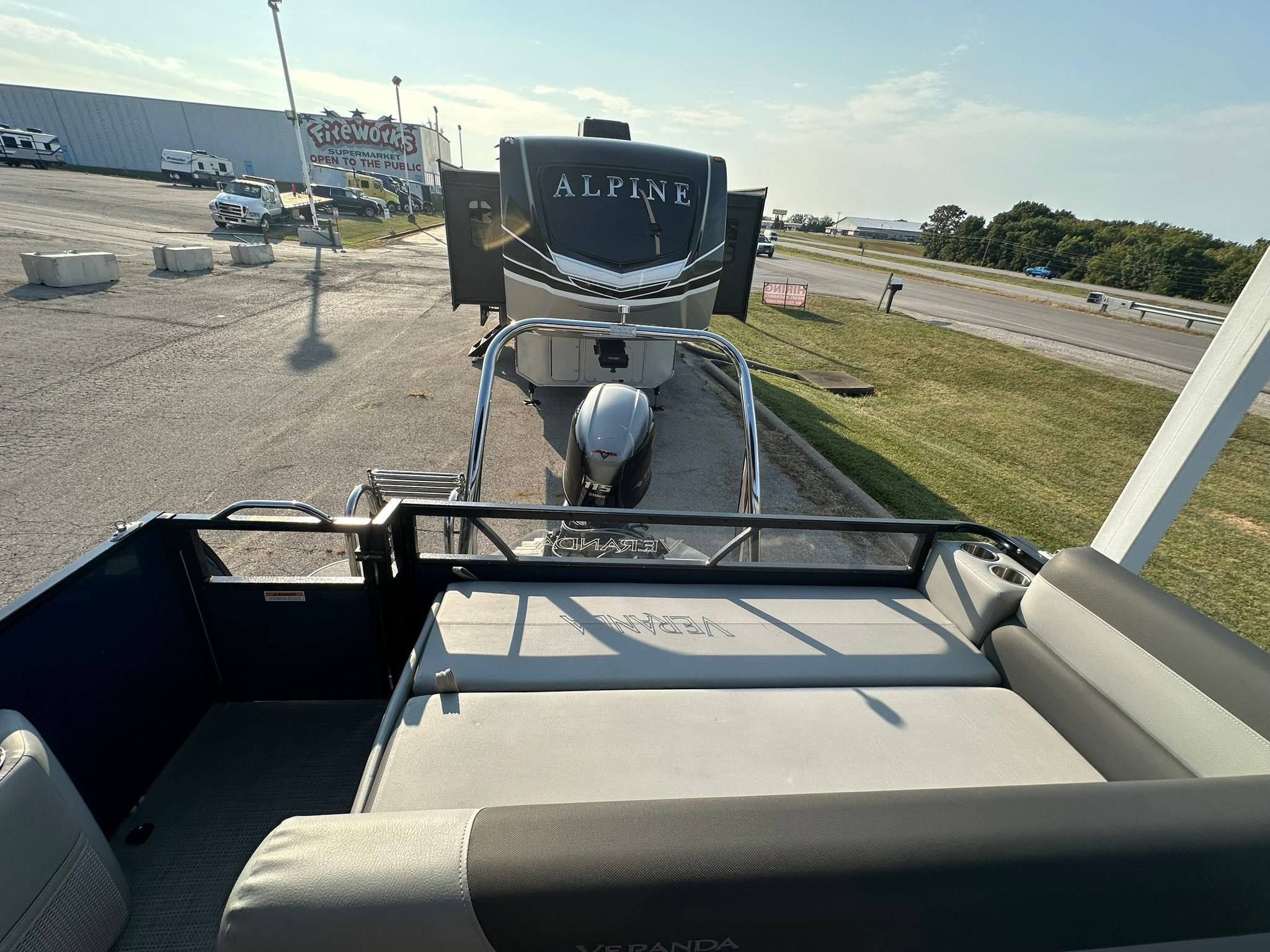 2023 Veranda Relax VR25VLB pontoon boat in parking lot.