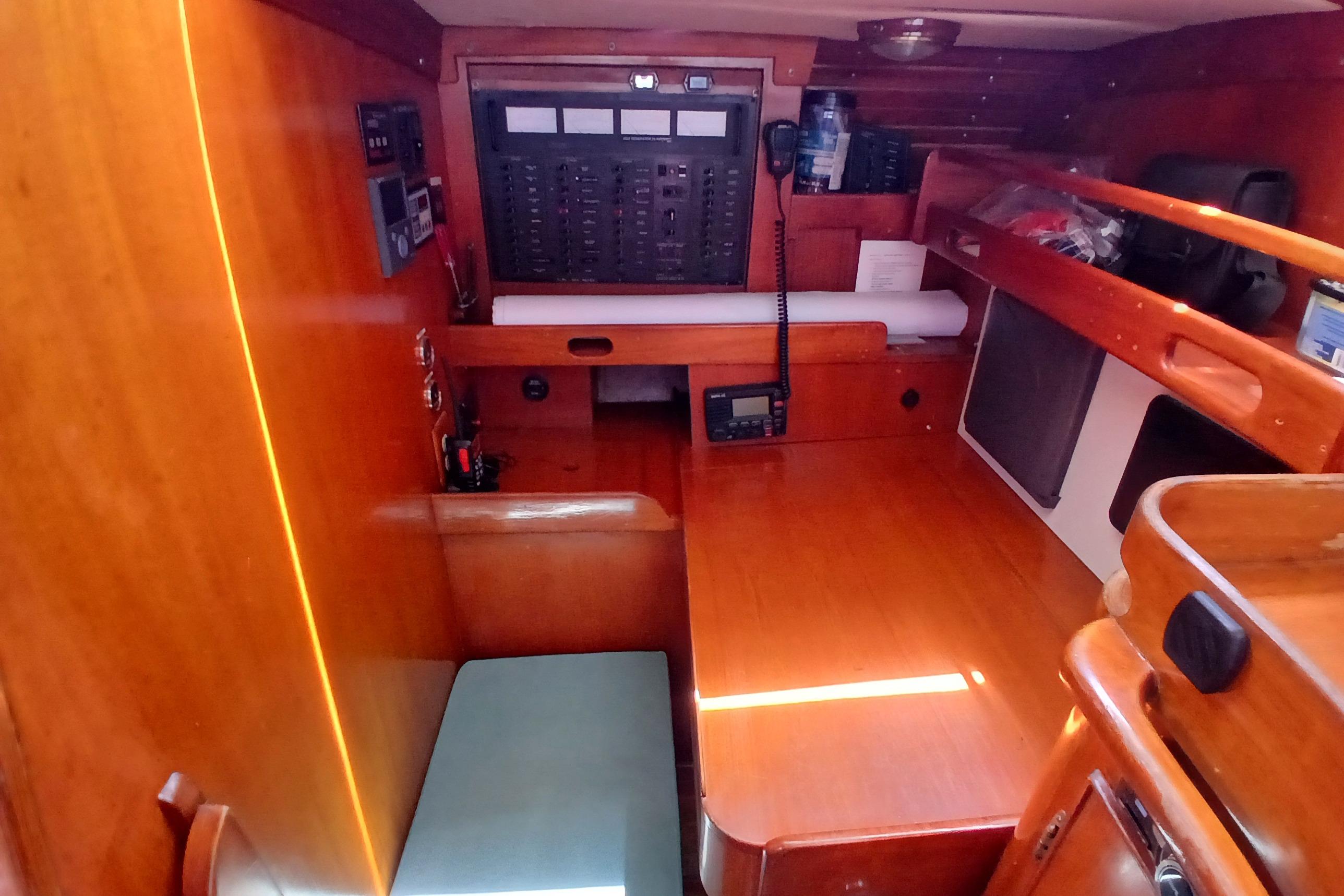 Interior of 1981 SKYE 51 yacht with navigation station and wooden furnishings.