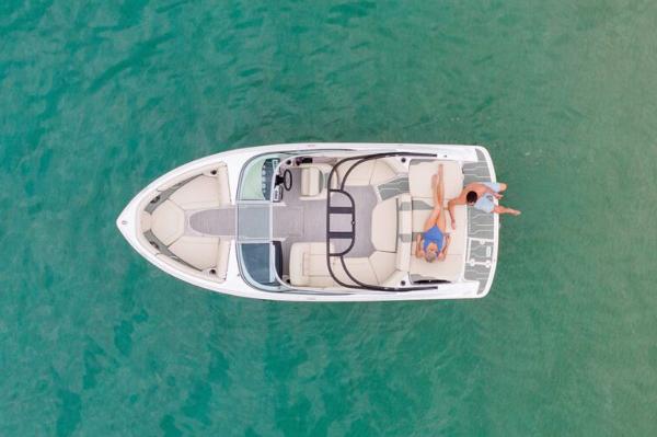 Manufacturer Provided Image: Aerial view of a 2026 Regal 2000 ES boat with two people relaxing on deck.