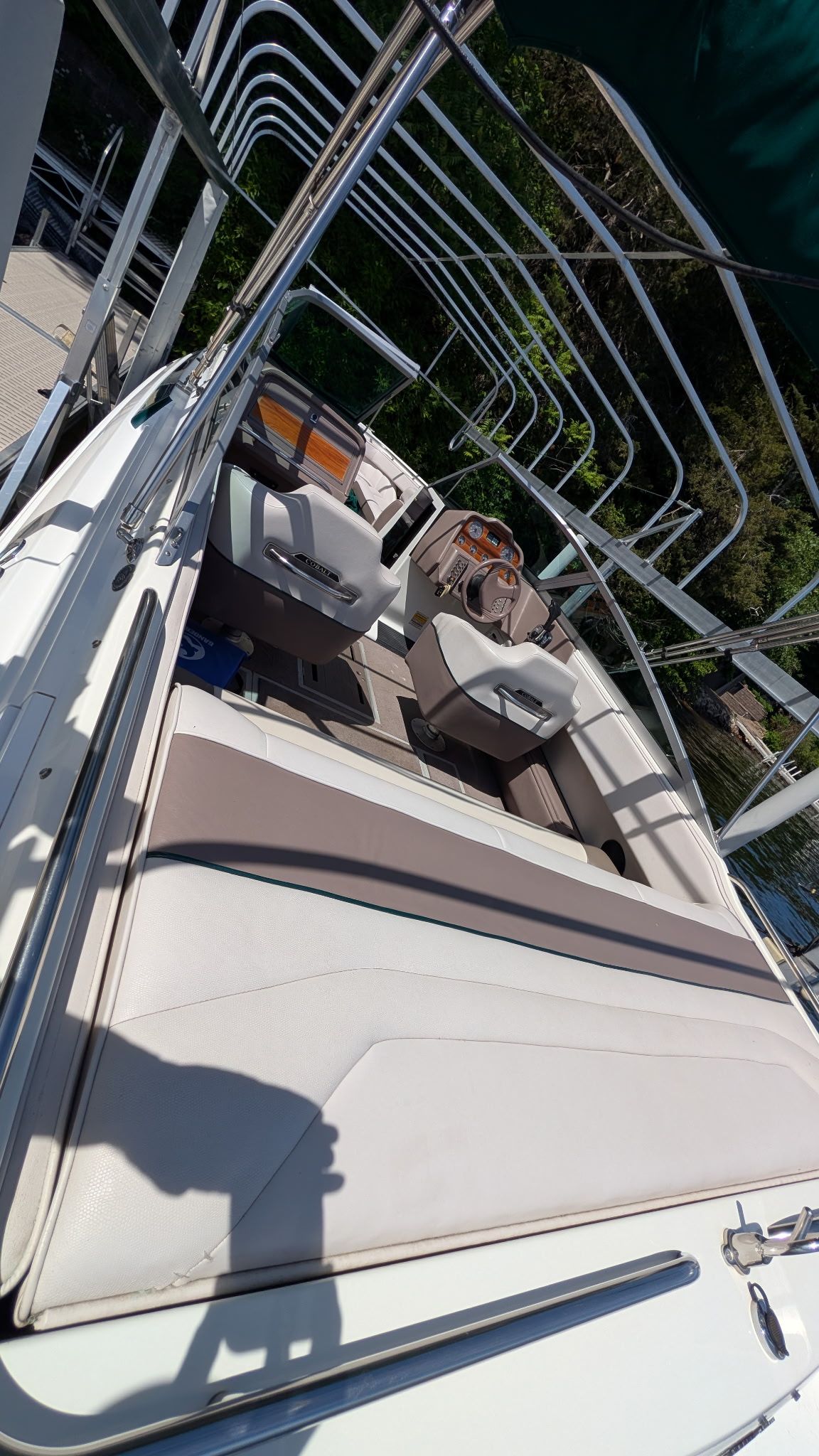 The image shows the interior of a 1995 Cobalt 222 boat with beige seating.