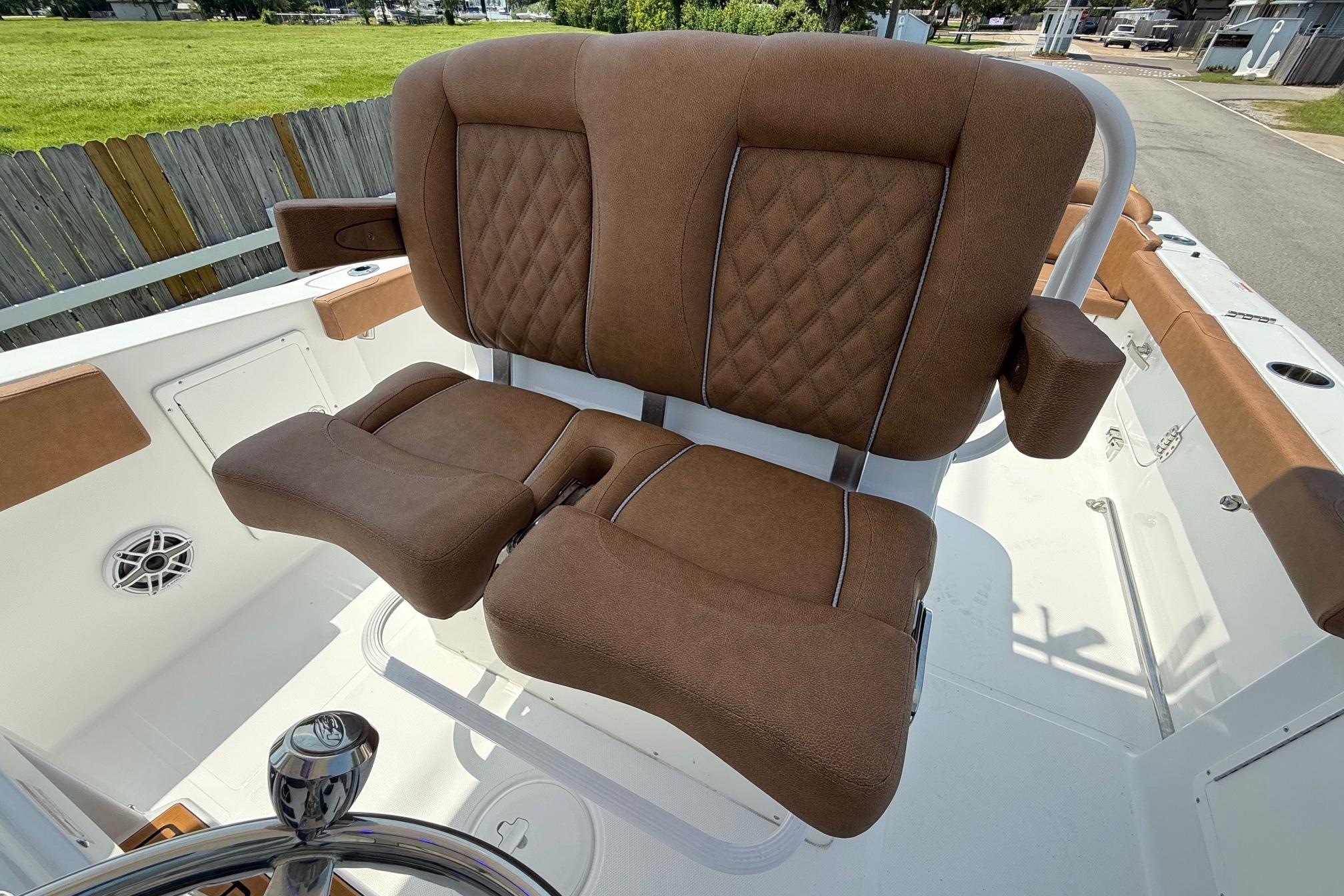 Luxurious brown seating on 2026 Sea Hunt Ultra 305 SE boat, featuring diamond stitching.