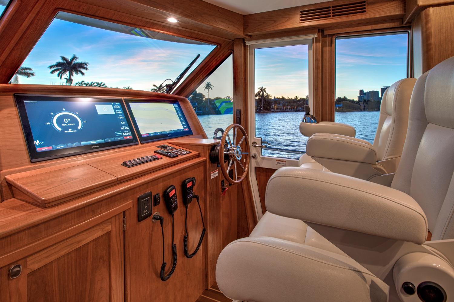 Interior helm of 2025 Sabre 58 Salon Express yacht with modern navigation system.