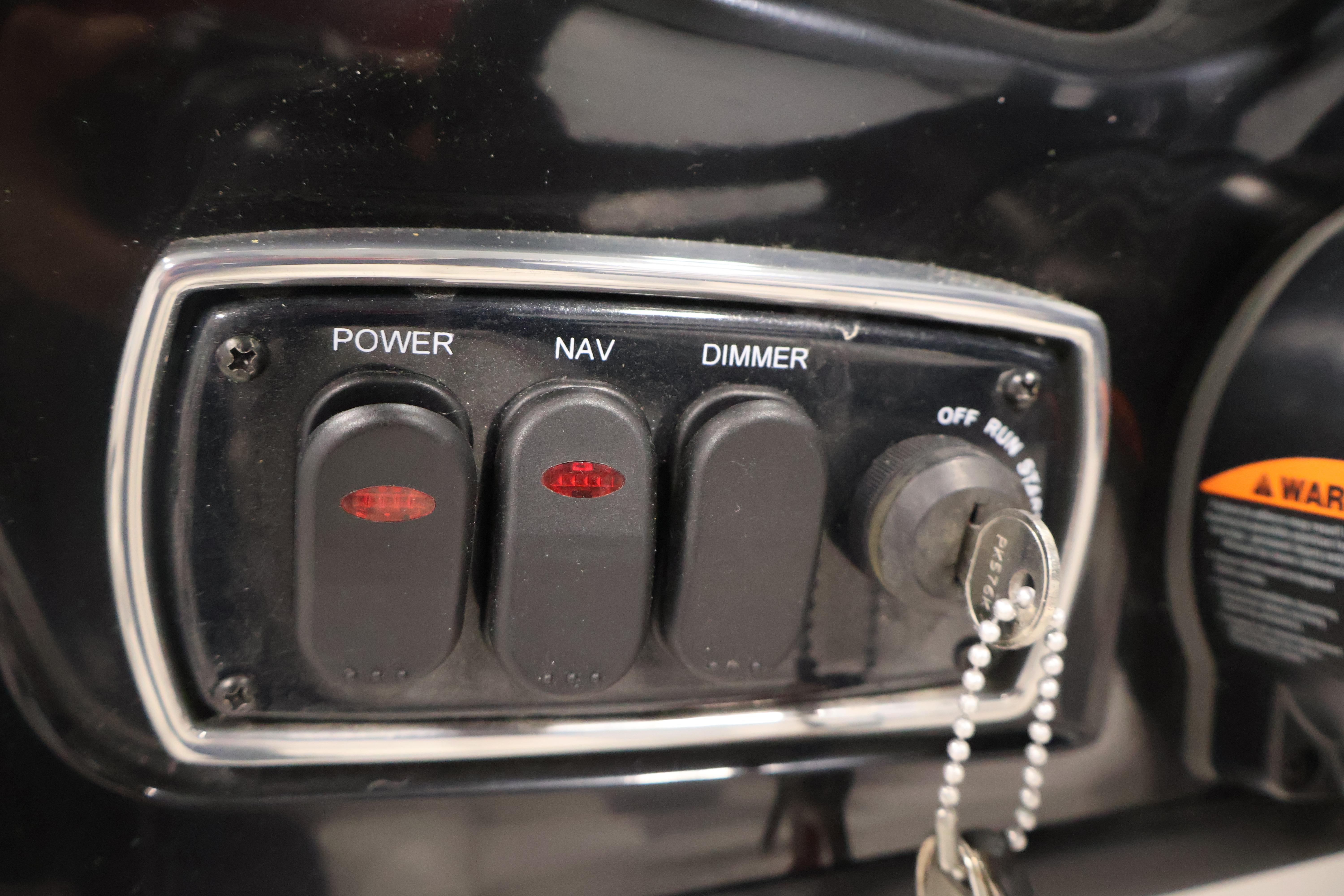 Control panel of a 2019 Nitro Z19 Sport boat with switches and ignition key.