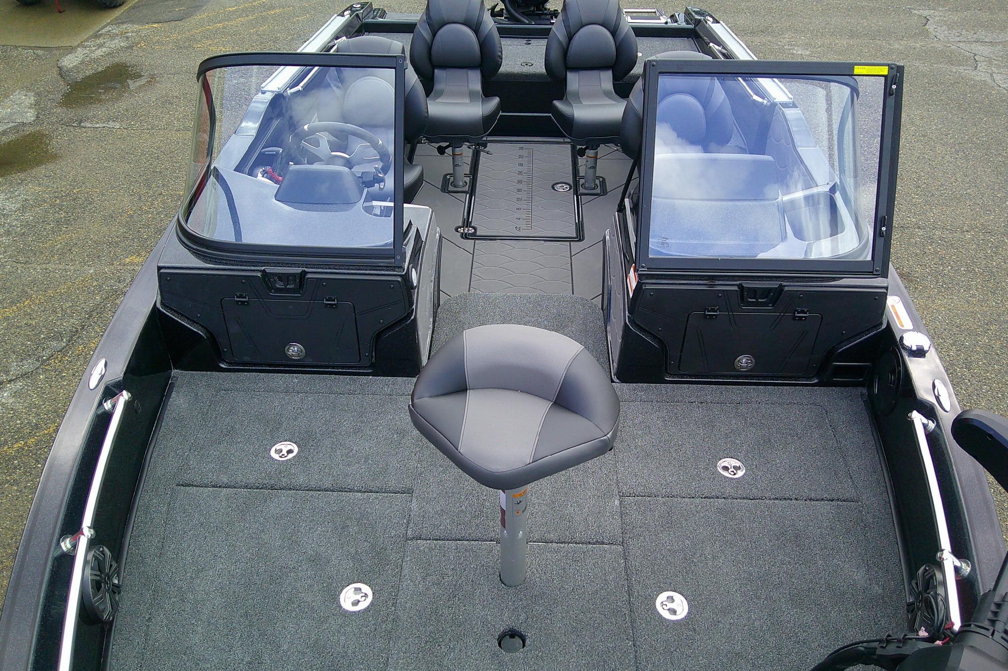 Interior view of a 2026 Nitro ZV20 boat, featuring seating and carpeted deck.