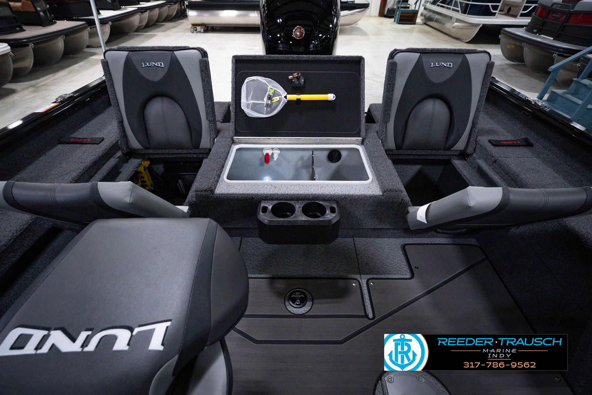 2026 Lund 1875 Impact XS SS boat interior with seating and storage compartments.