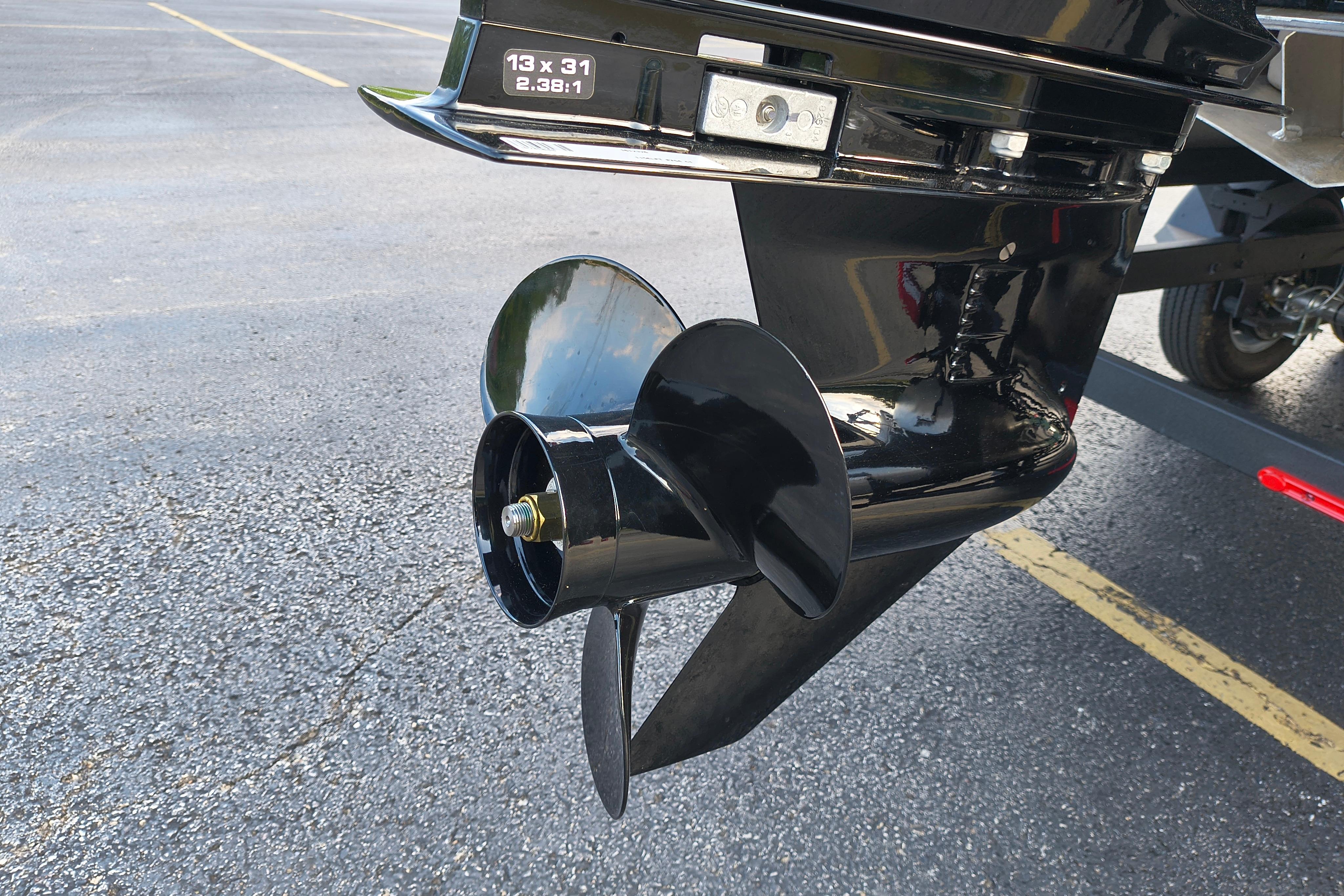 Propeller of 2026 Sun Tracker Fishin' Barge 22 DLX on asphalt surface.