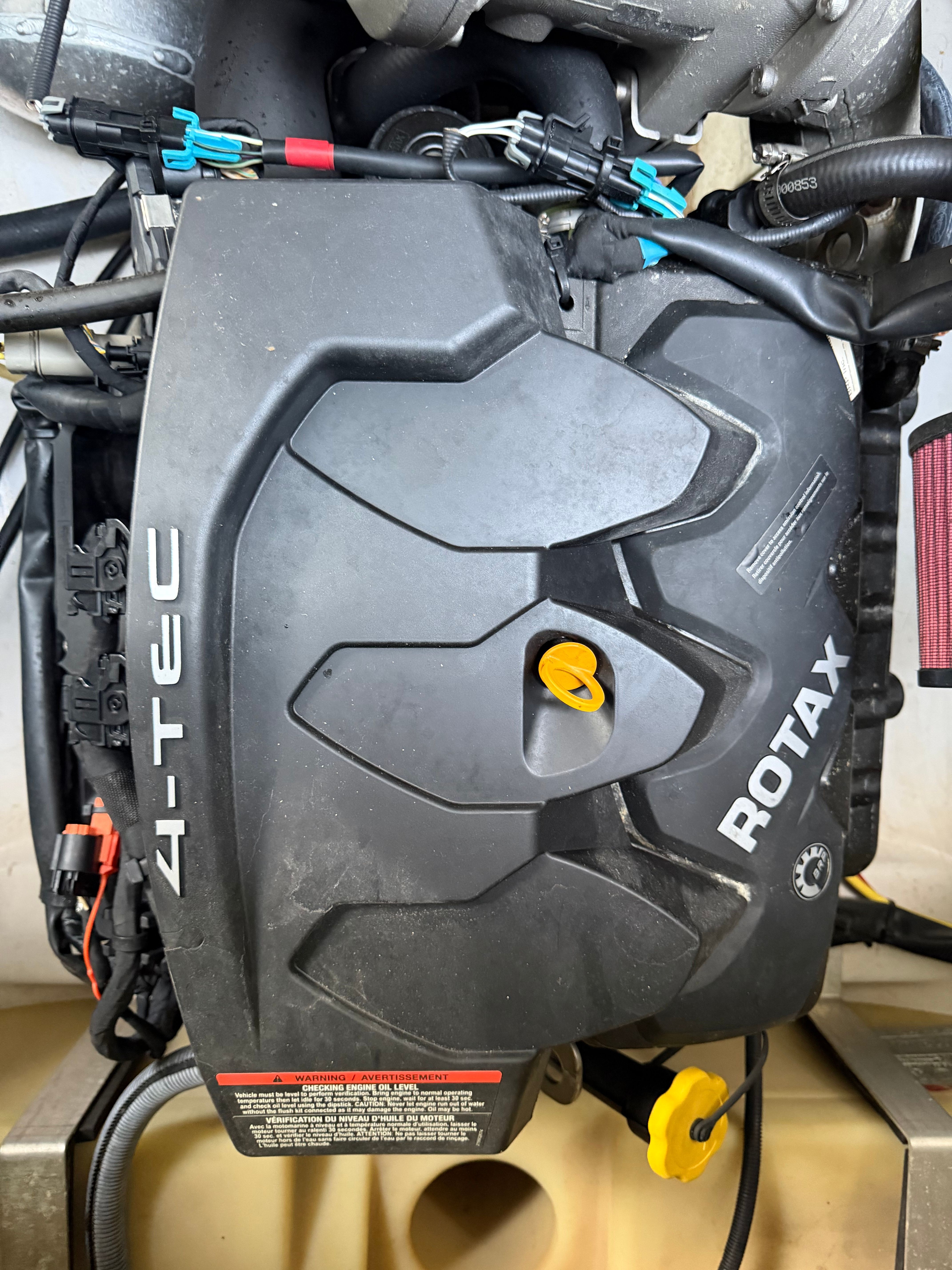 Engine cover of a 2015 Scarab 165 boat with Rotax 4-TEC branding.