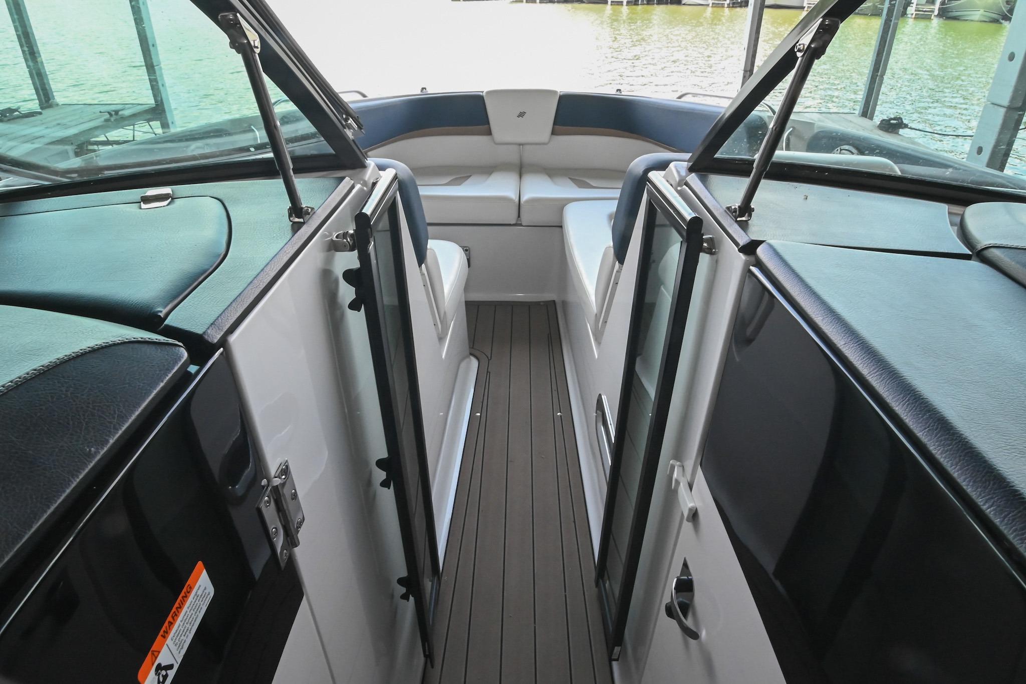 2014 Four Winns H290 boat interior with seating and open deck view.