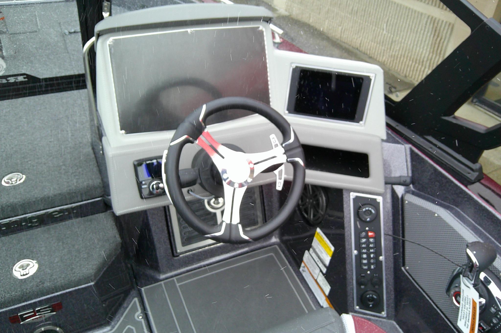 2026 Ranger 620xFS Pro boat dashboard with steering wheel and control panels.