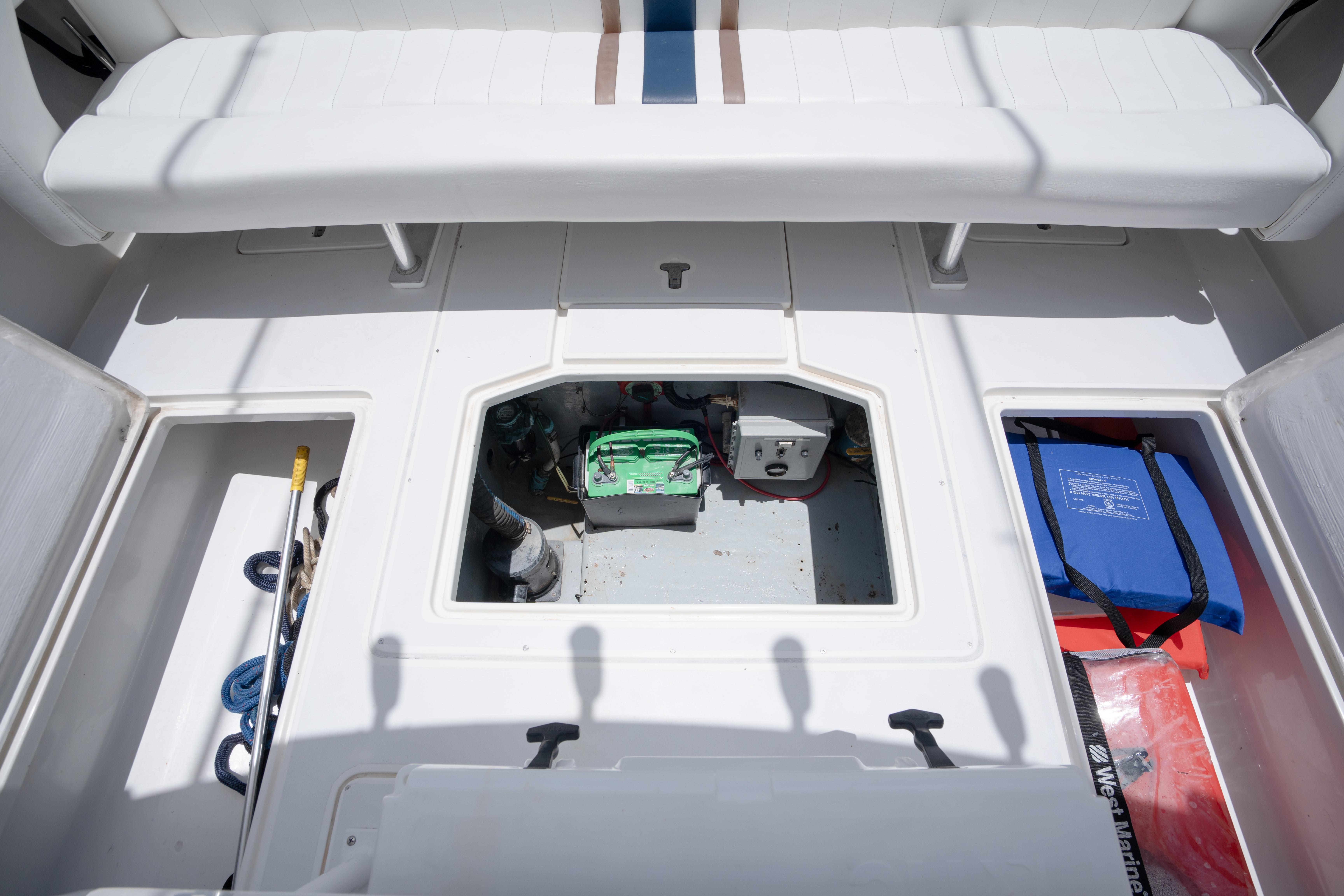1999 Intrepid 35 boat interior with storage compartments and equipment.