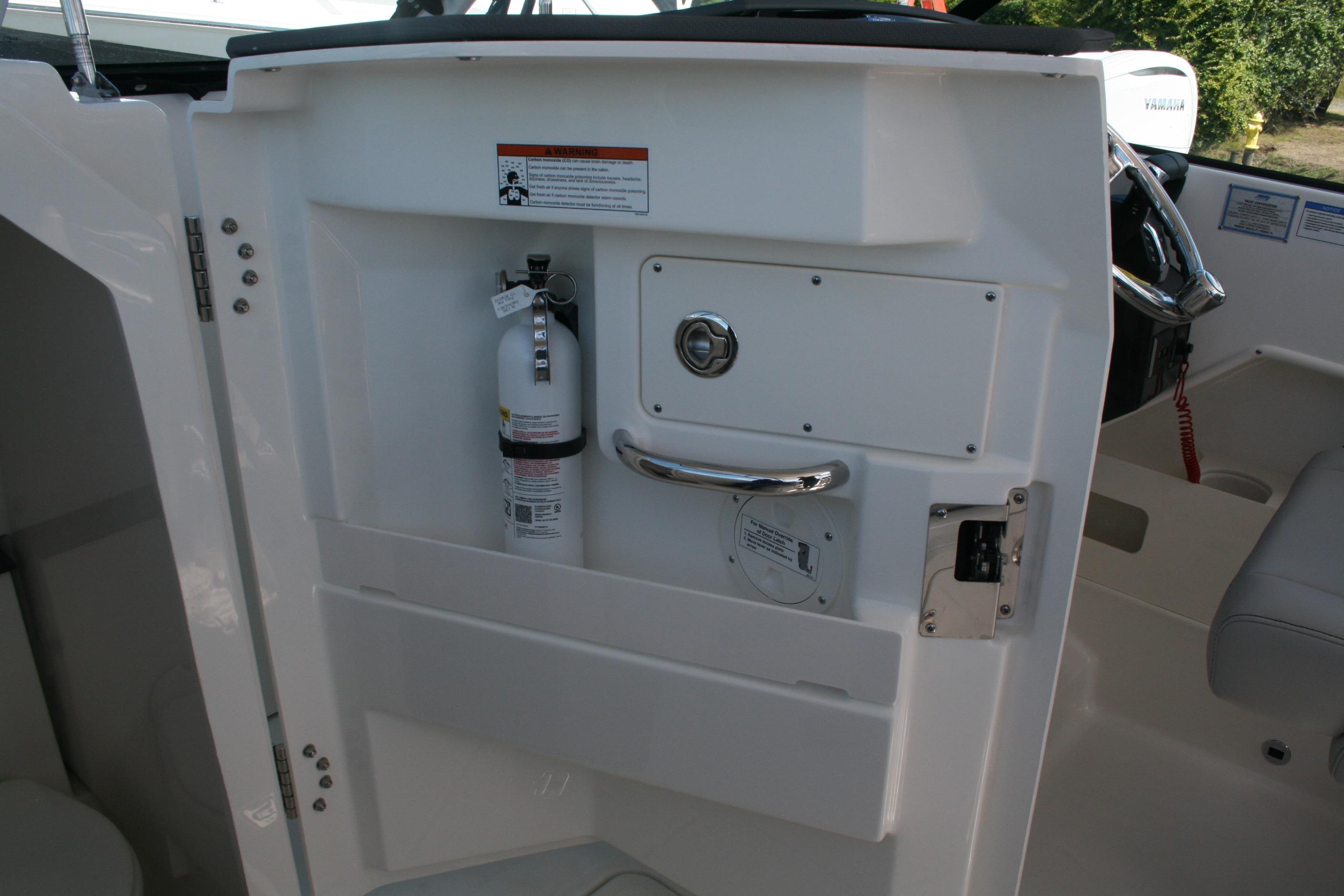 2026 Pursuit DC 266 Dual Console interior with fire extinguisher and safety features.