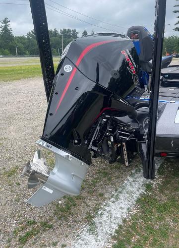 2025 Ranger Z520R boat with a powerful outboard motor, parked on gravel.
