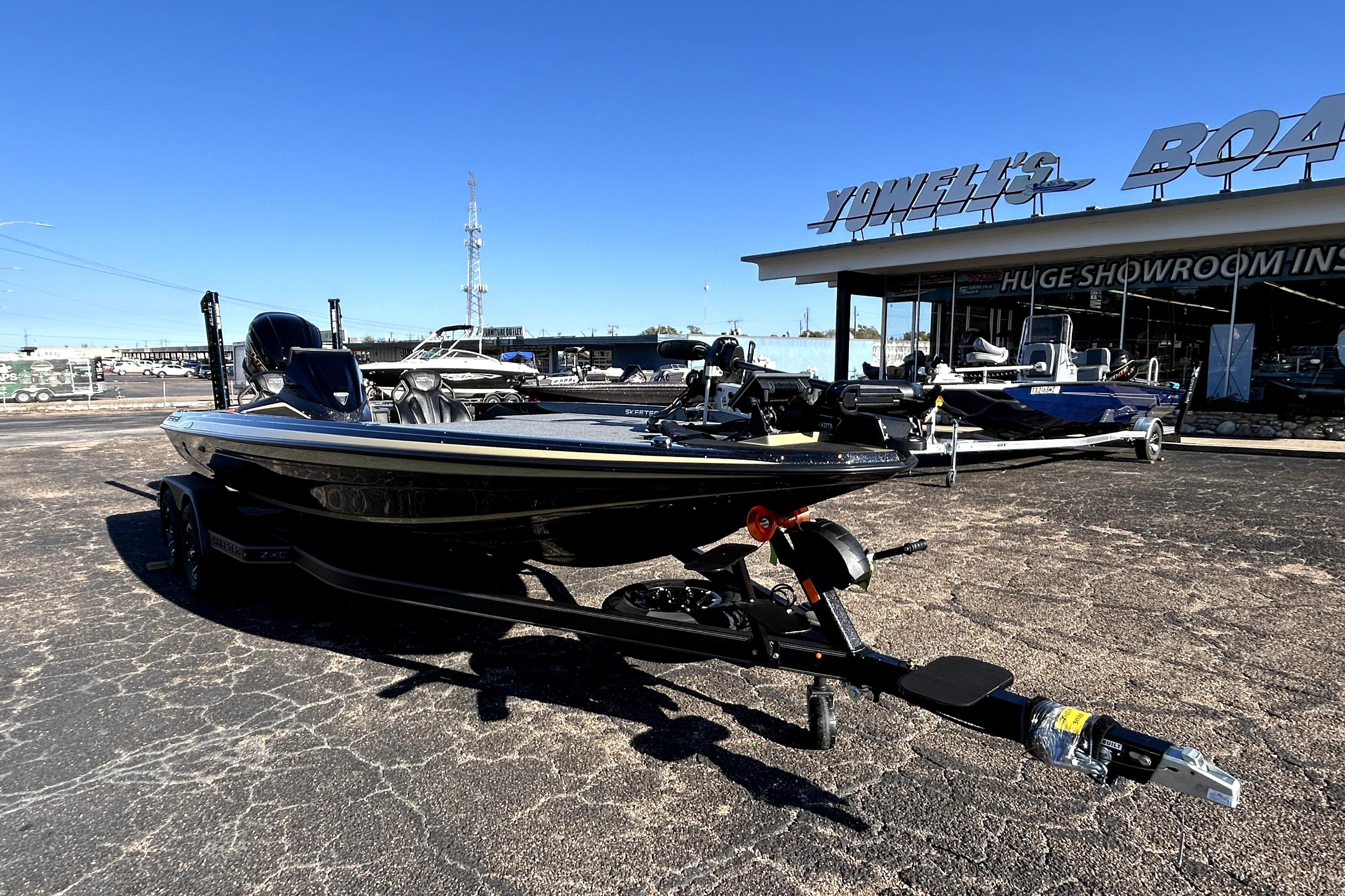2026 Skeeter ZXE21 boat displayed outside showroom on a sunny day.