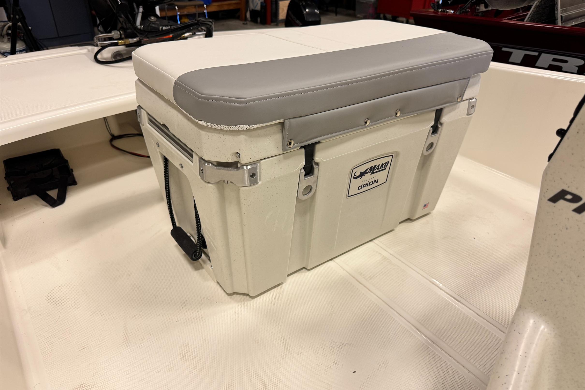 2026 Mako Pro Skiff 15 CC with cushioned storage seat on deck.