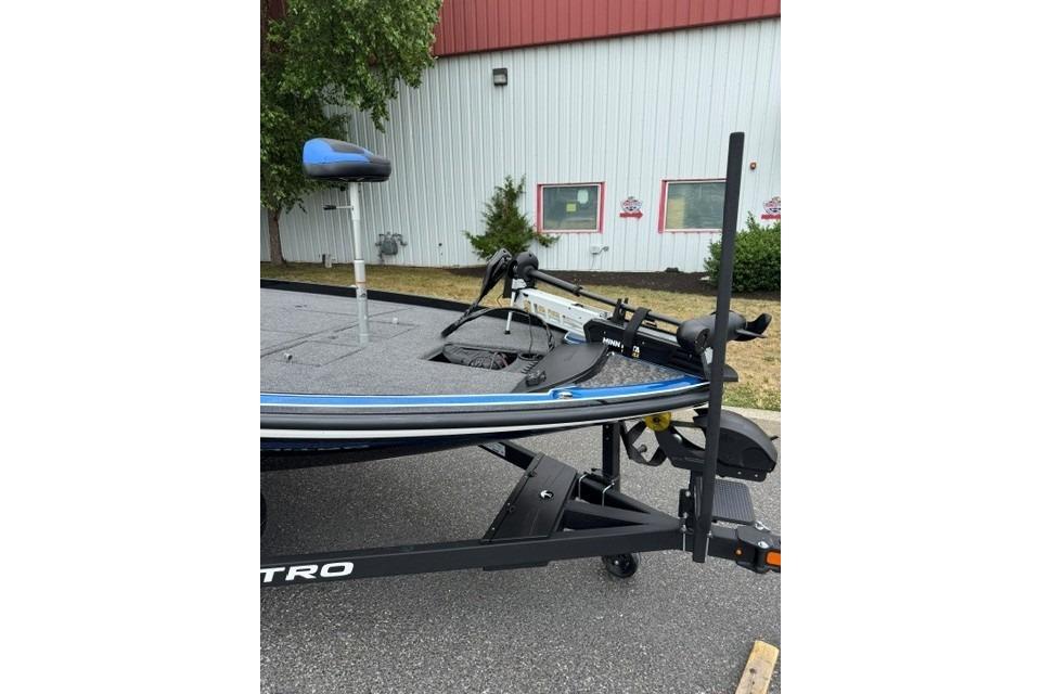 2026 Nitro Z21 XL boat on trailer, parked outdoors near a building.