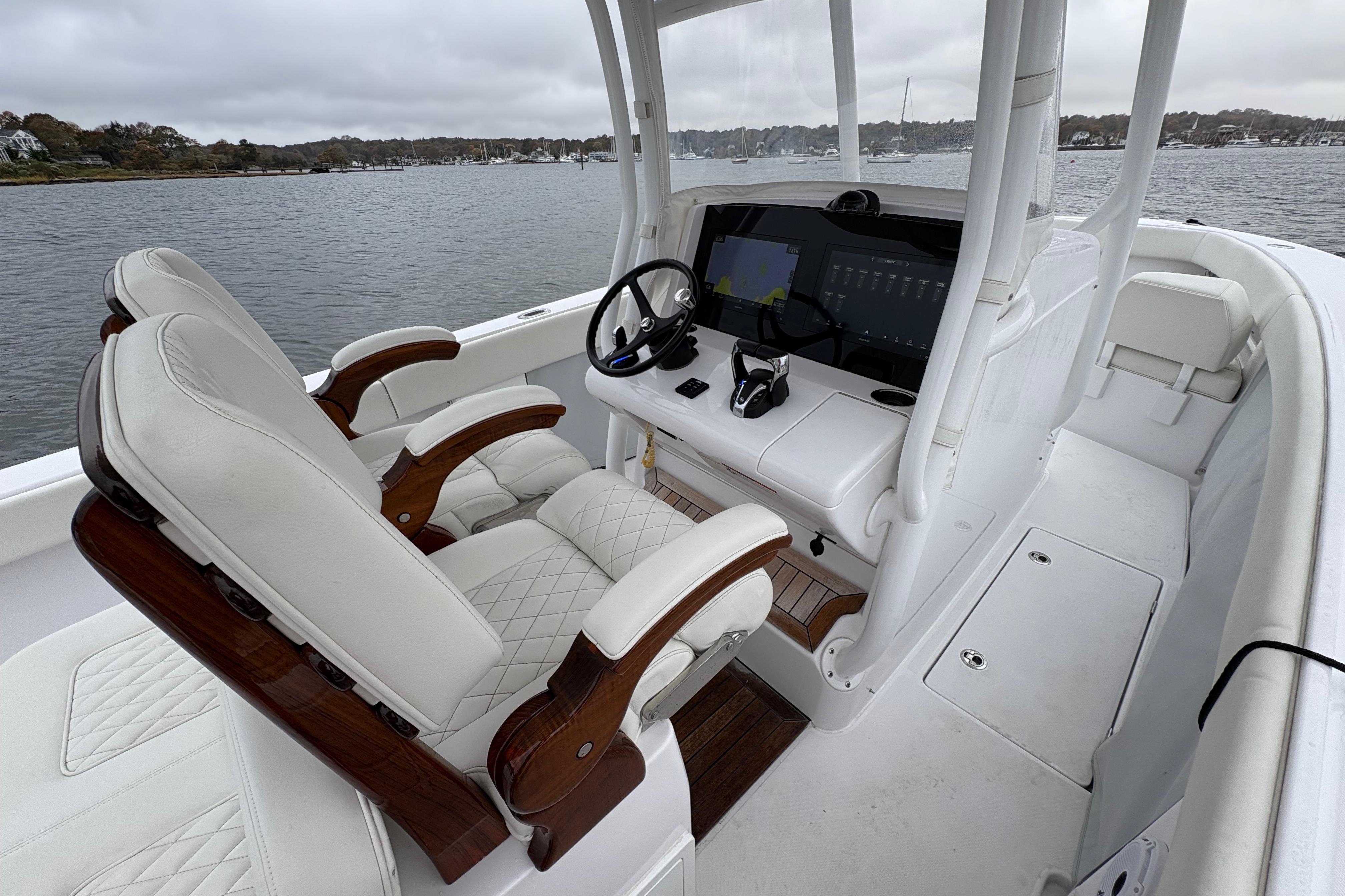 Interior of 2023 Jupiter 30 boat with luxurious seating and advanced navigation system.