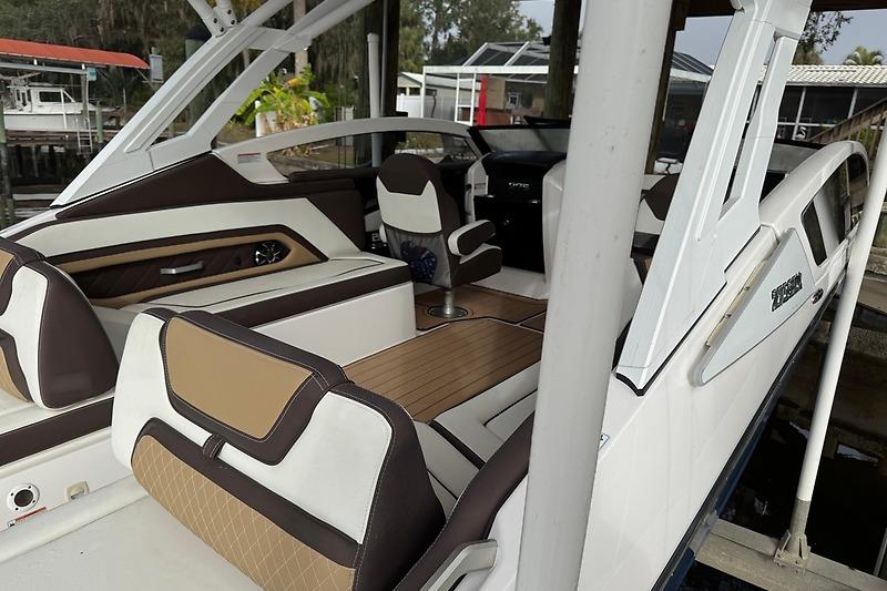 2023 Yamaha 275SDX boat interior with luxurious seating and modern design.