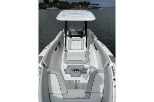 2023 Sea Fox 268 Commander boat, sleek design, spacious deck, coastal background.