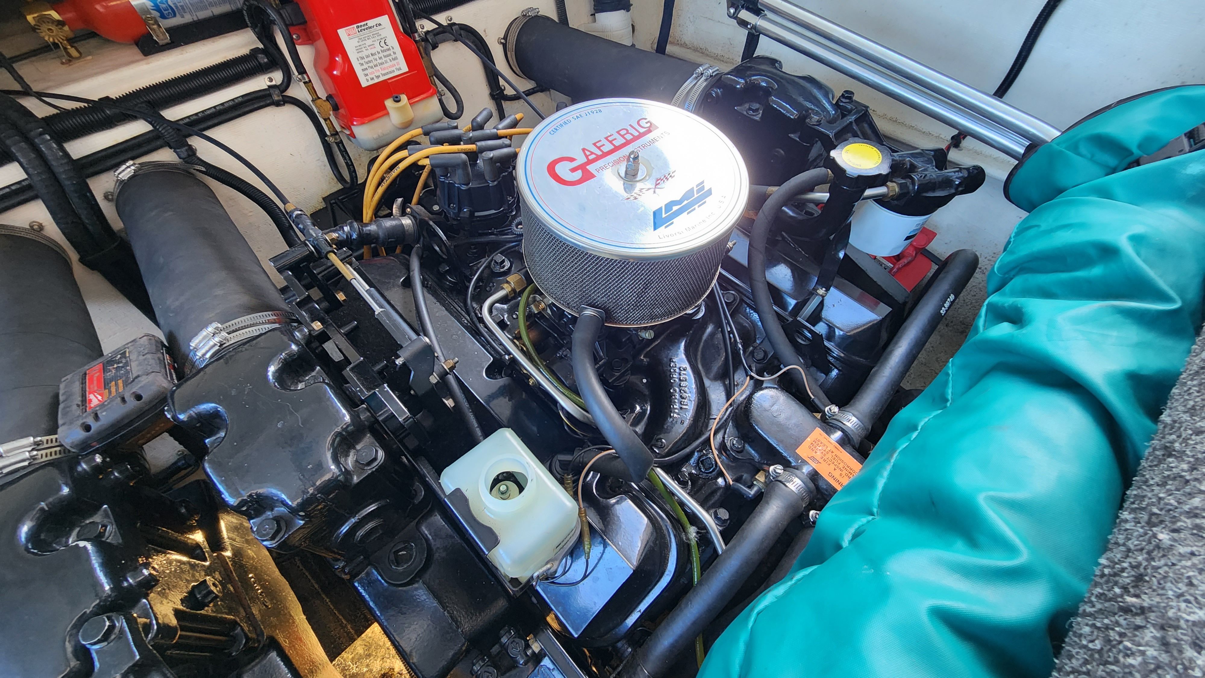 Engine compartment of a 1998 Powerquest Enticer 290 FX with visible engine and components.