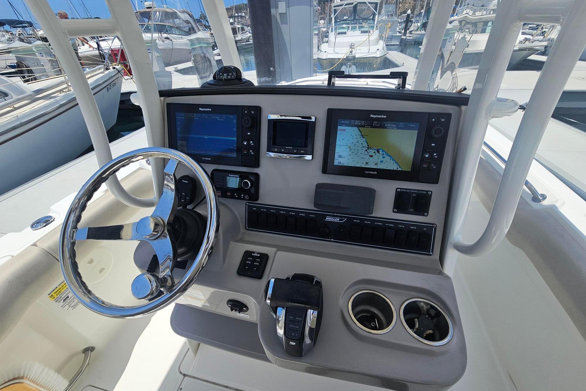 2017 Boston Whaler 230 Outrage helm with advanced navigation systems and controls.